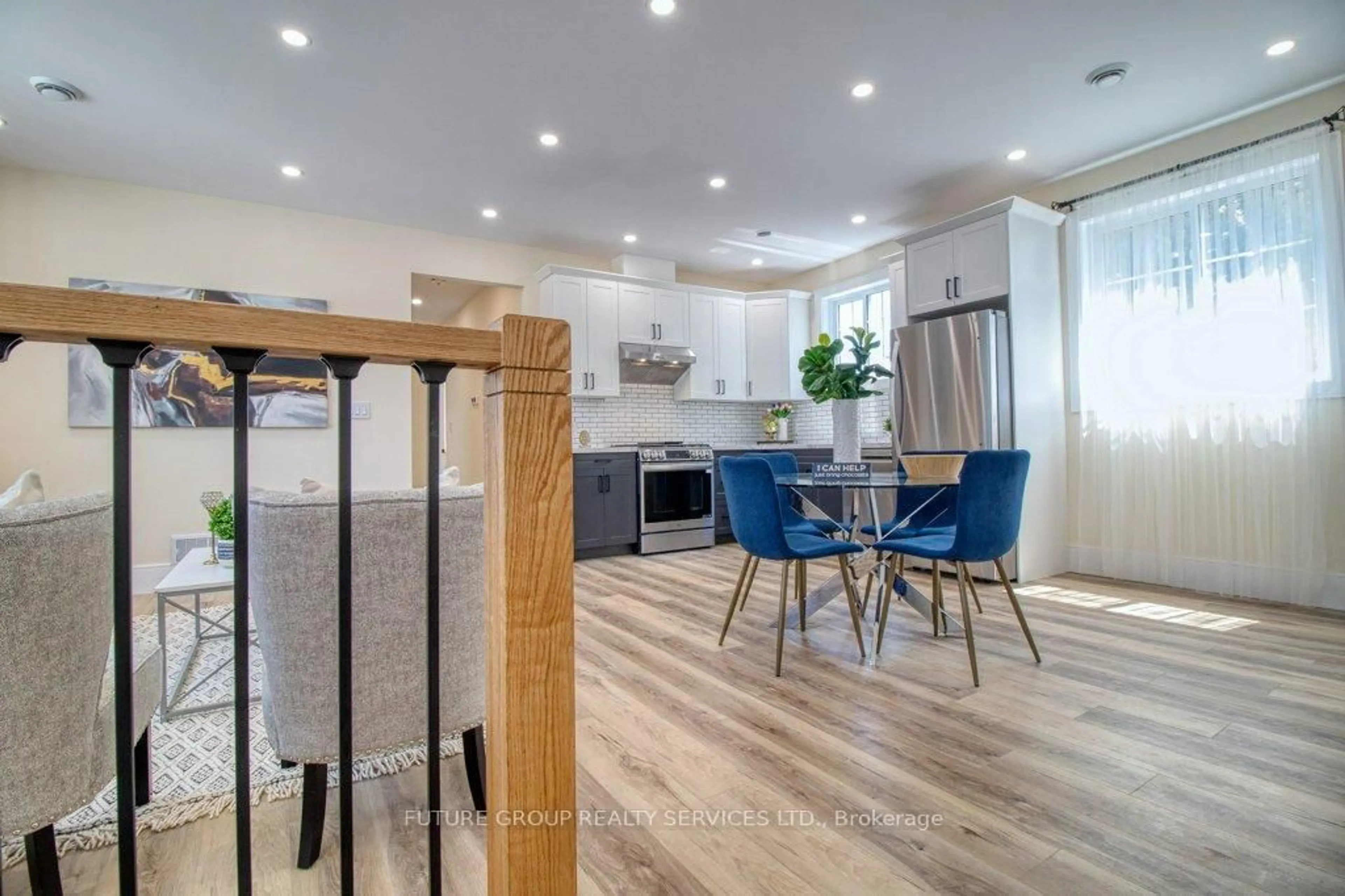 Open concept kitchen, wood/laminate floor for 109 Penrose St, Sarnia Ontario N7T 4T9