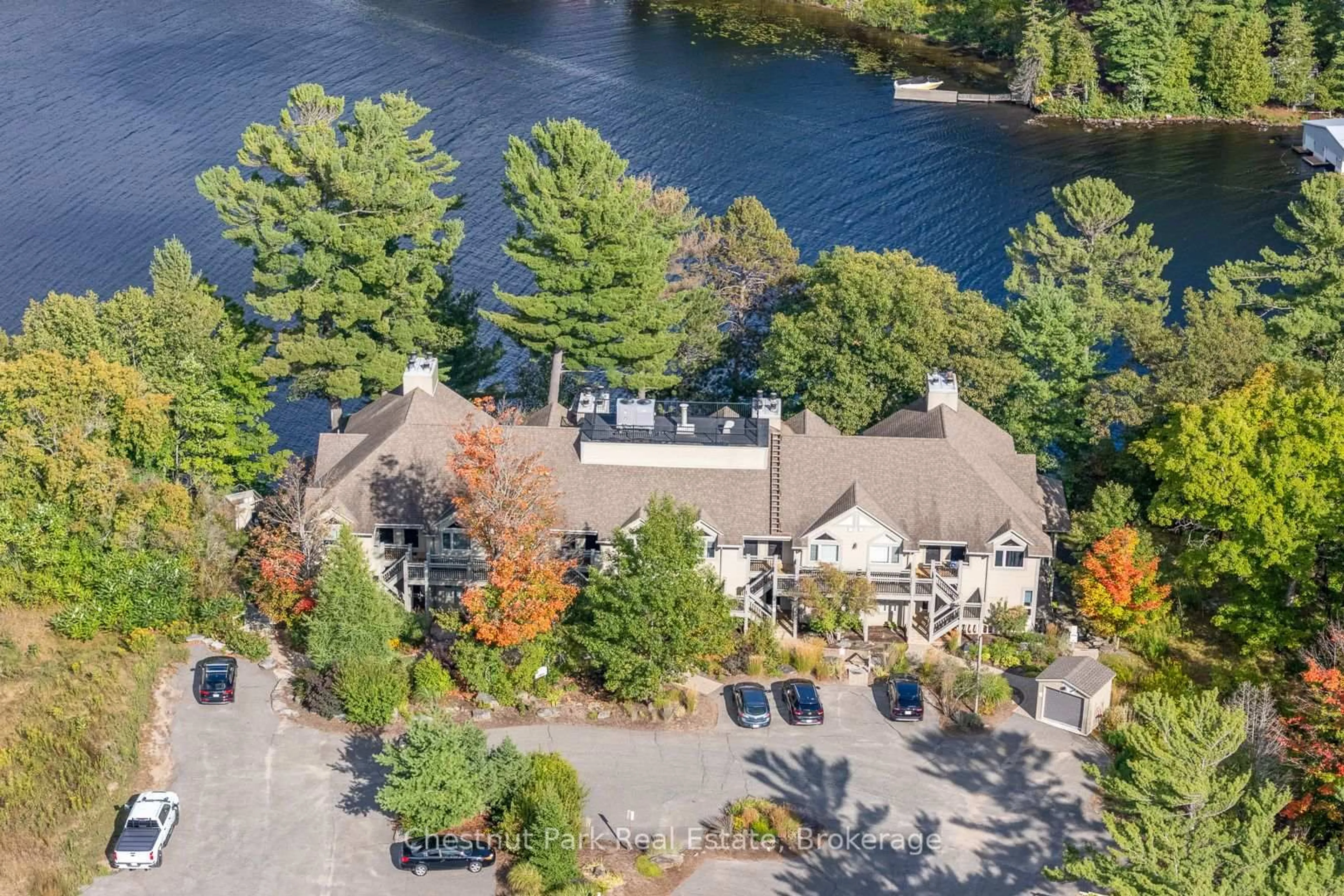 A pic from outside/outdoor area/front of a property/back of a property/a pic from drone, water/lake/river/ocean view for 5521 Grandview Signature Dr, Huntsville Ontario P1H 2N1