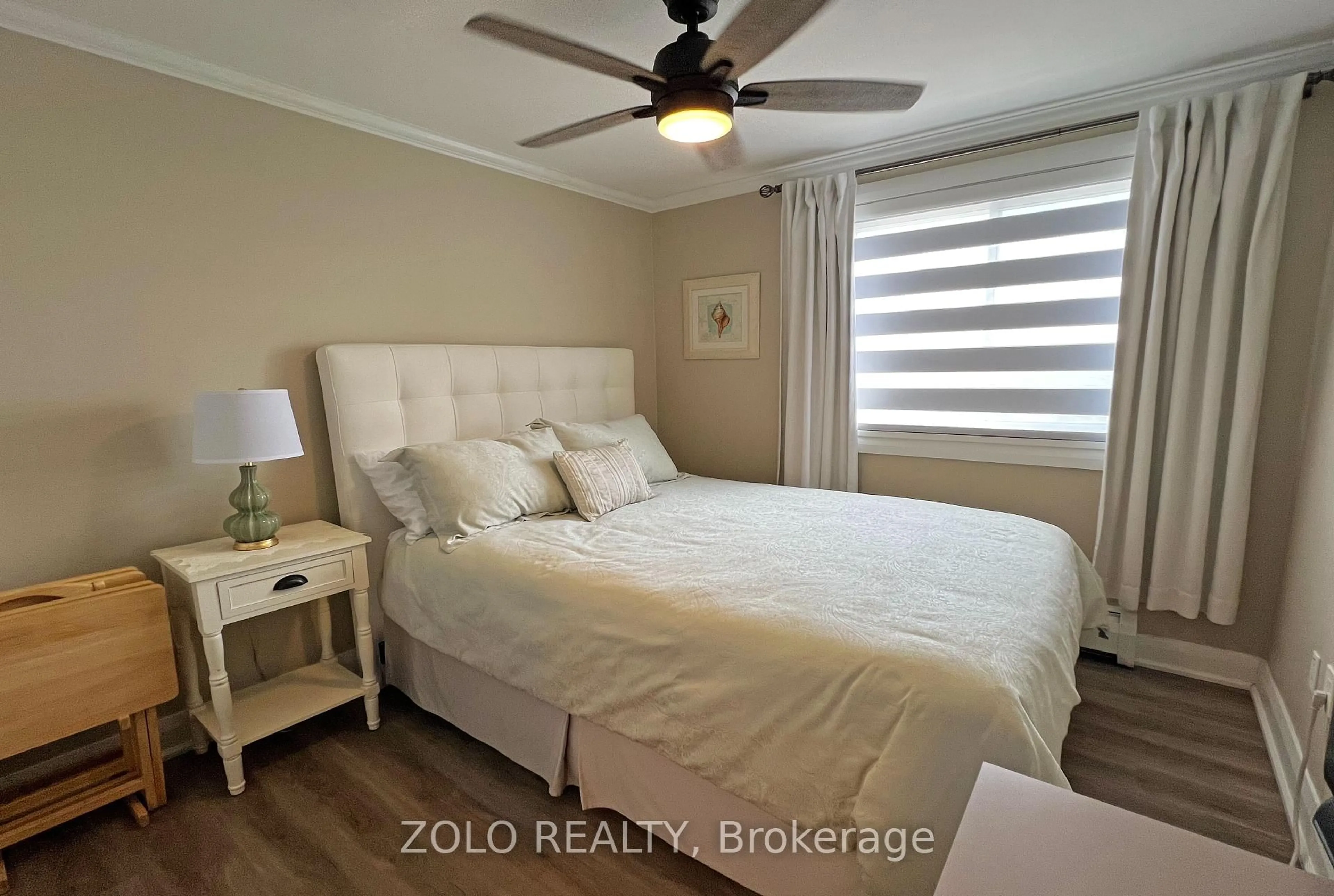 Bedroom with bed, wood/laminate floor for 915 Elmsmere Rd #1011, Ottawa Ontario K1J 8H8