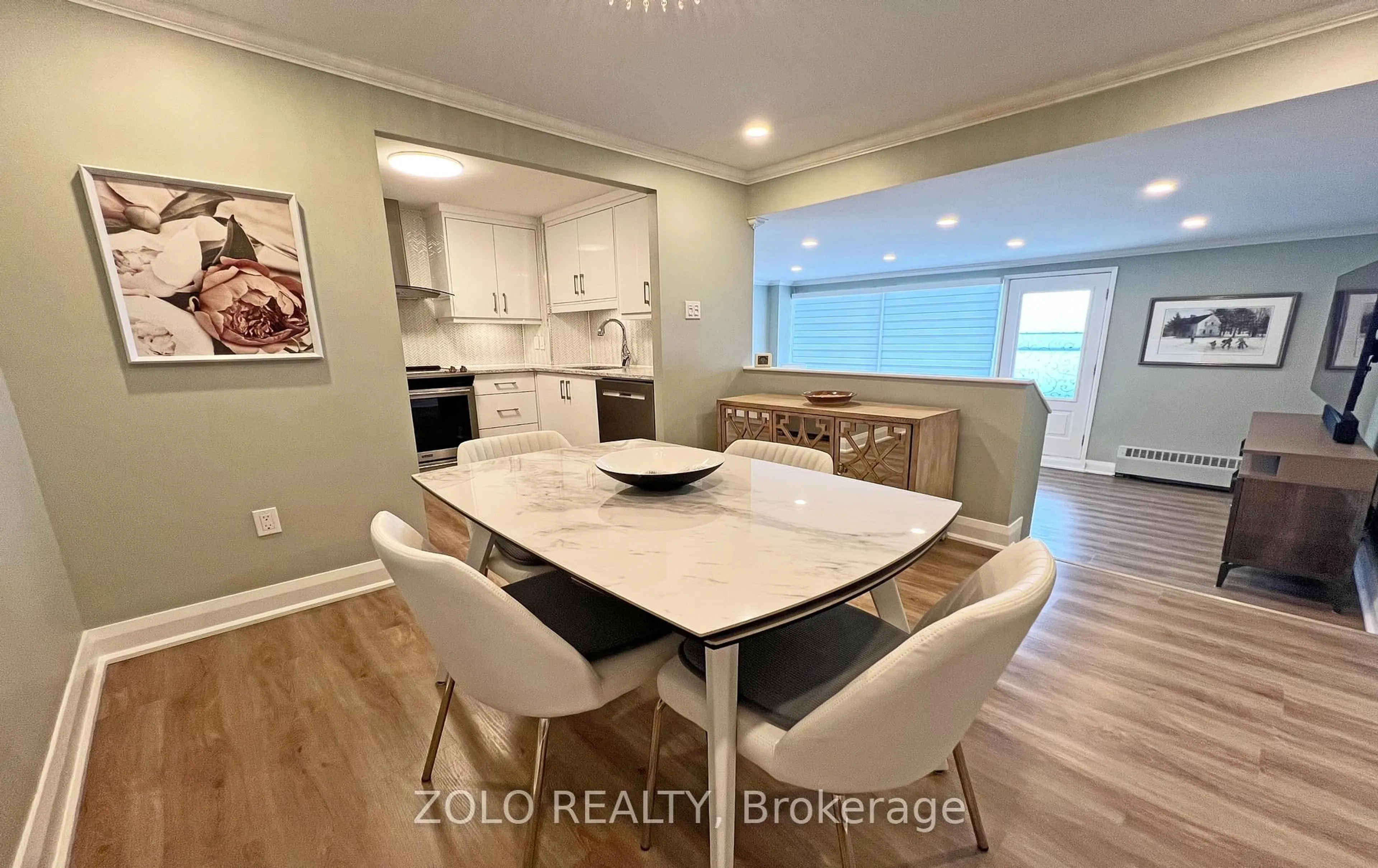 Open concept kitchen, wood/laminate floor for 915 Elmsmere Rd #1011, Ottawa Ontario K1J 8H8