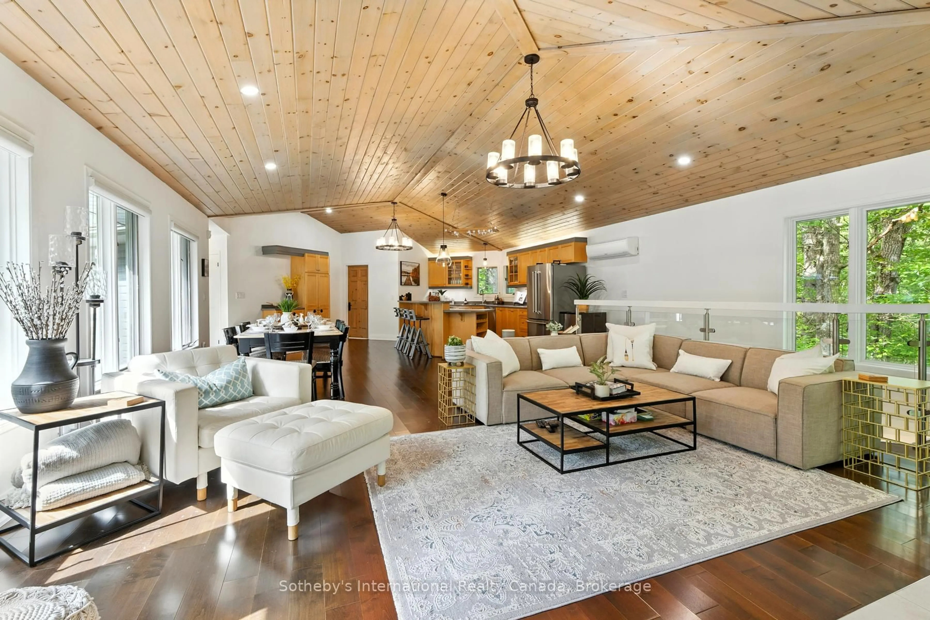Living room with furniture, wood/laminate floor for 1060 North Kahshe Lake Rd, Gravenhurst Ontario P0E 1G0