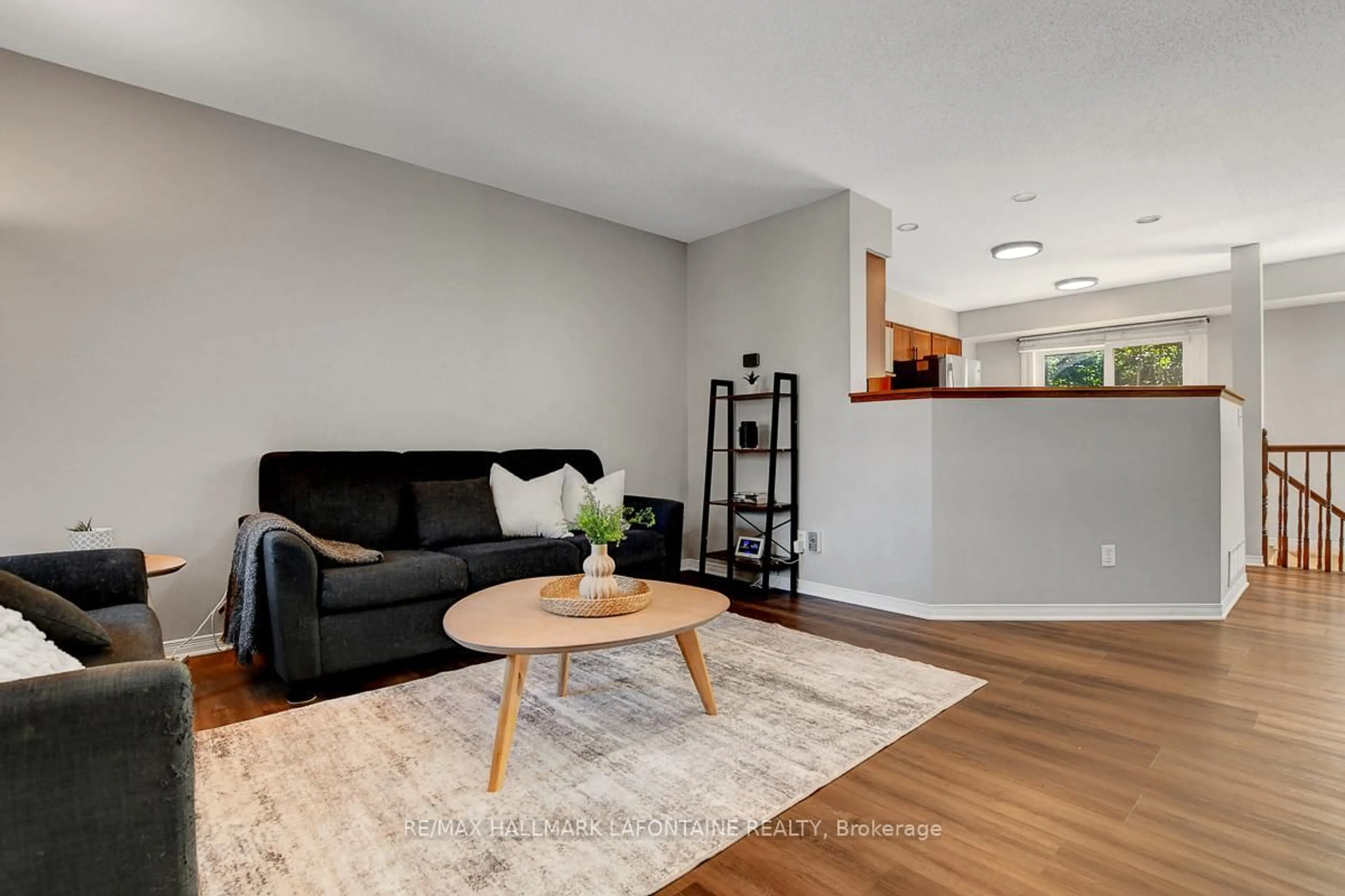 Living room with furniture, wood/laminate floor for 446 Lawler Cres, Ottawa Ontario K4A 3Y3