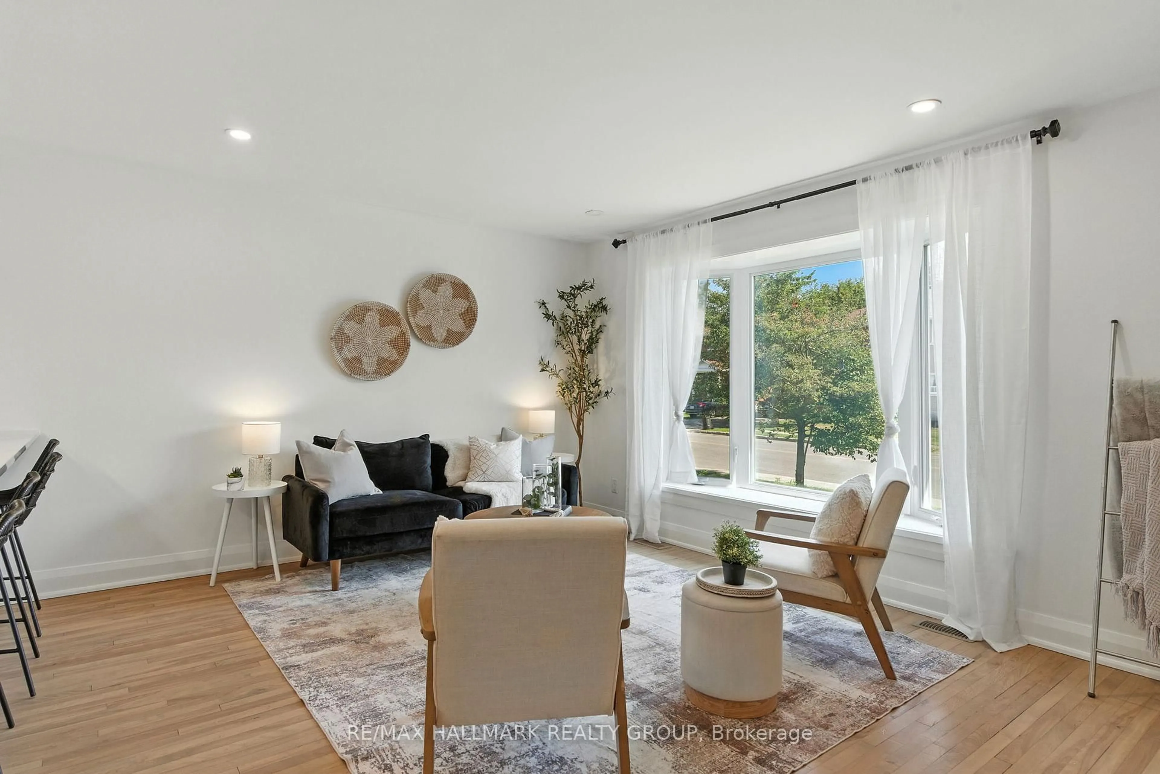 Living room with furniture, wood/laminate floor for 756 Cummings Ave, Ottawa Ontario K1K 2L1