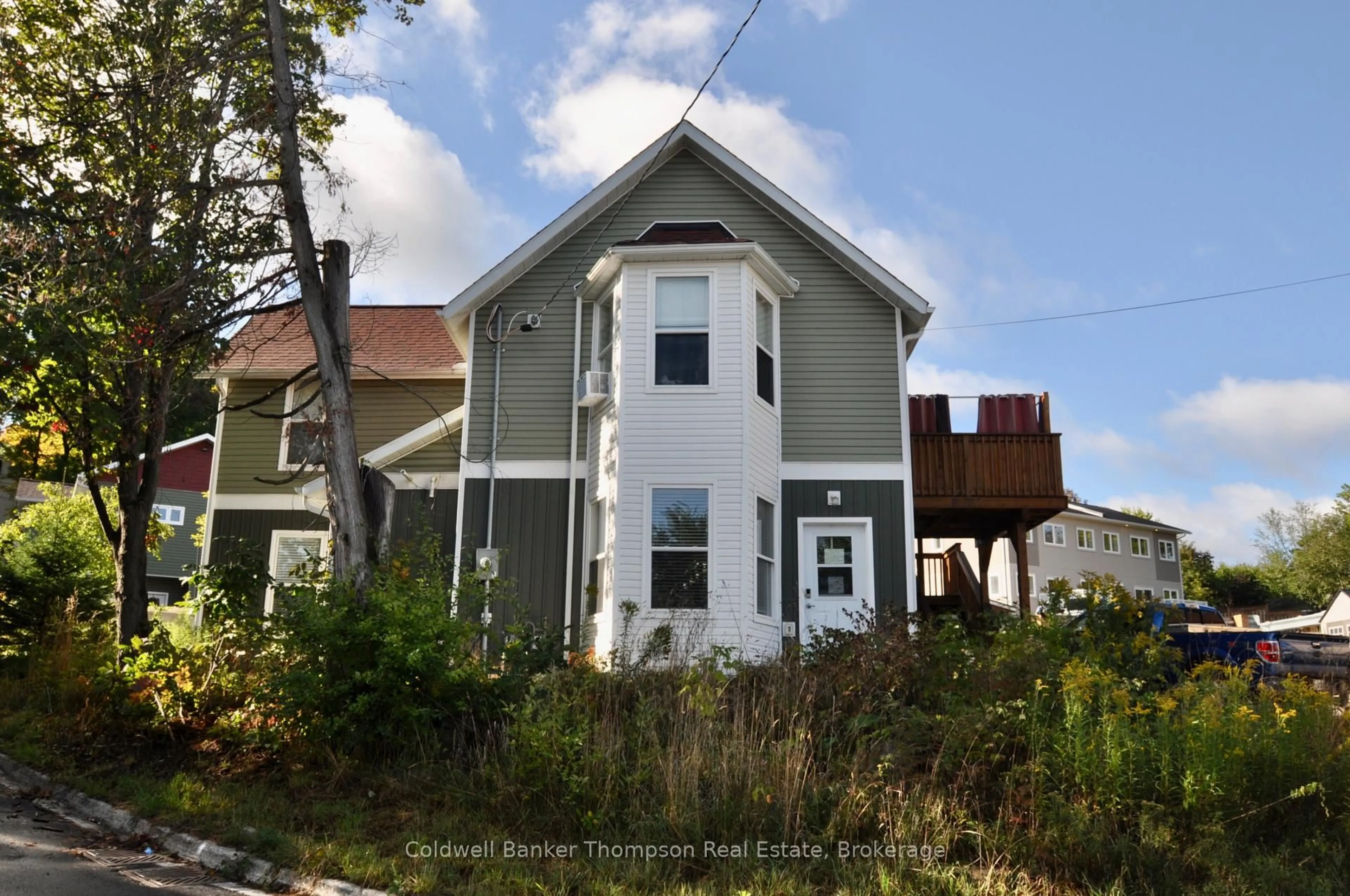 Home with vinyl exterior material, street for 111 Main St #1-2, Huntsville Ontario P1H 1W8