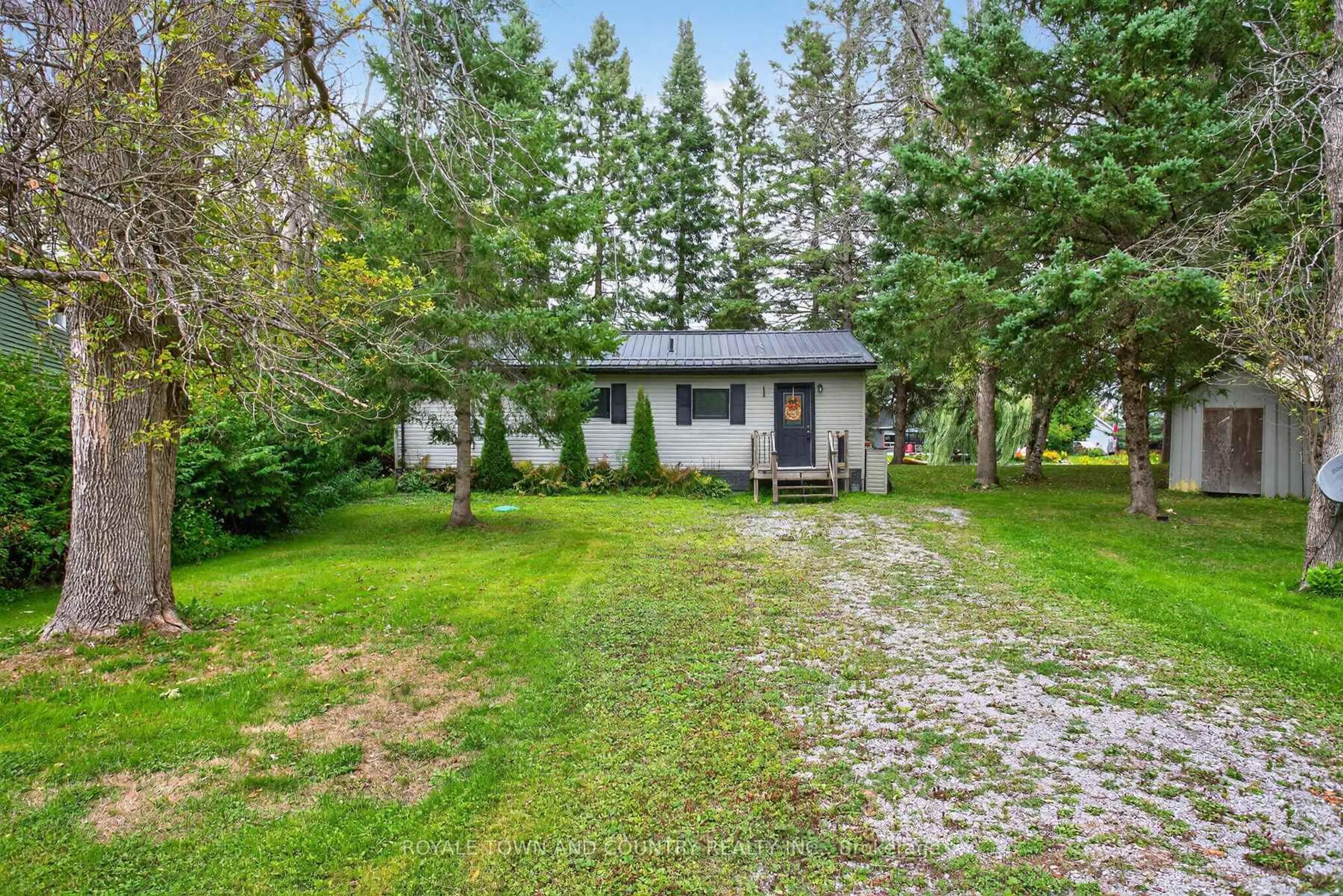 A pic from outside/outdoor area/front of a property/back of a property/a pic from drone, unknown for 82 Riverbank Rd, Kawartha Lakes Ontario K0M 1N0