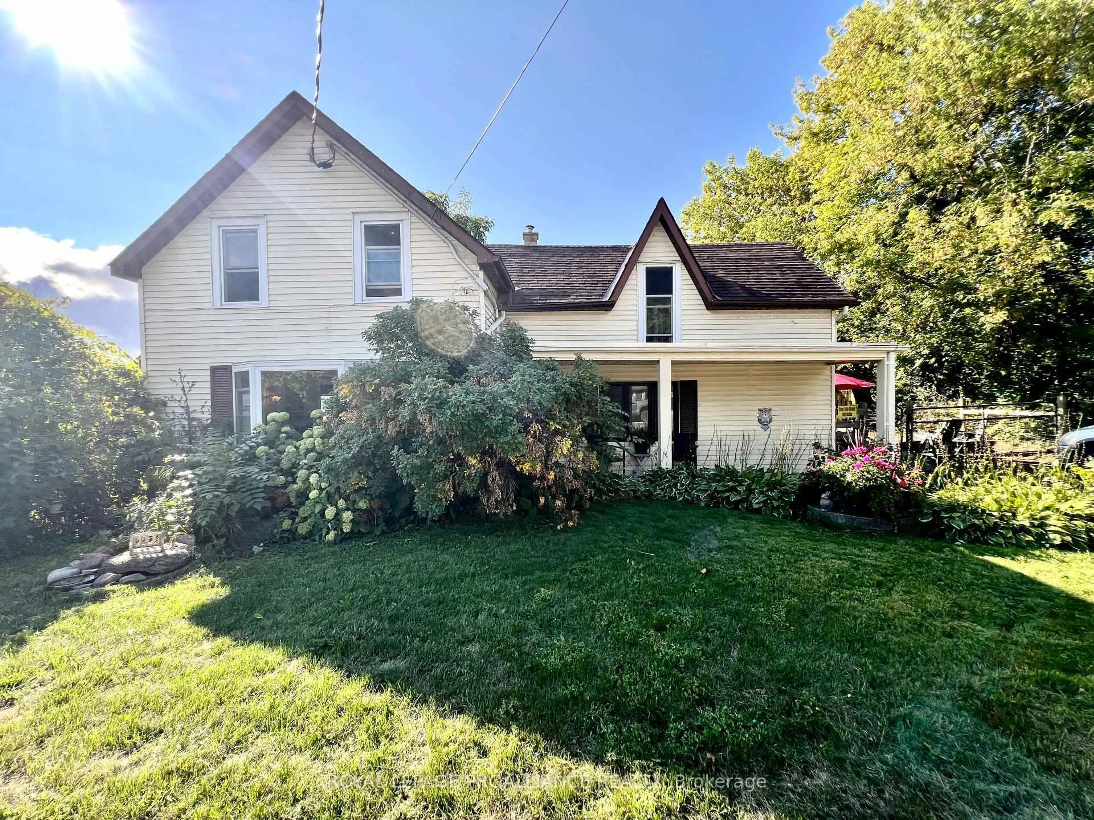 A pic from outside/outdoor area/front of a property/back of a property/a pic from drone, street for 1285 County Road 3, Prince Edward County Ontario K8N 4Z1