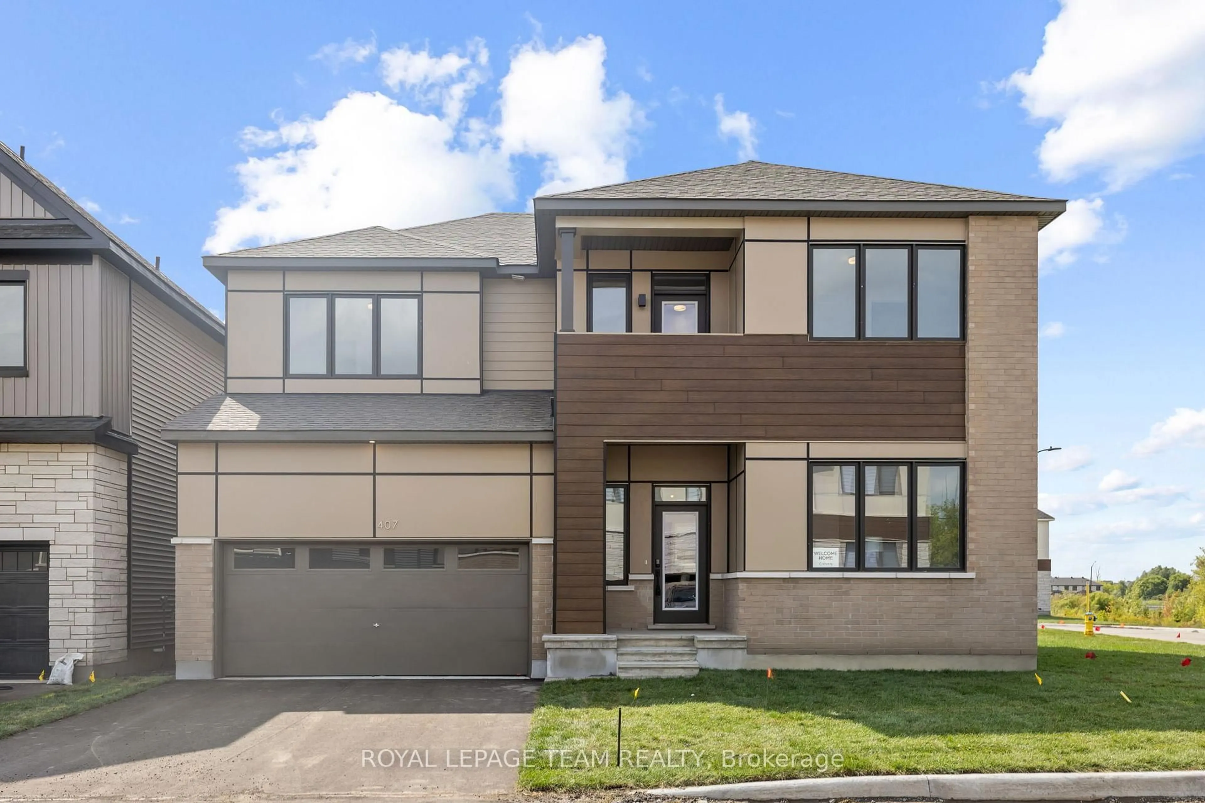 Home with brick exterior material, street for 407 Euphoria Cres, Barrhaven Ontario K2J 7M7