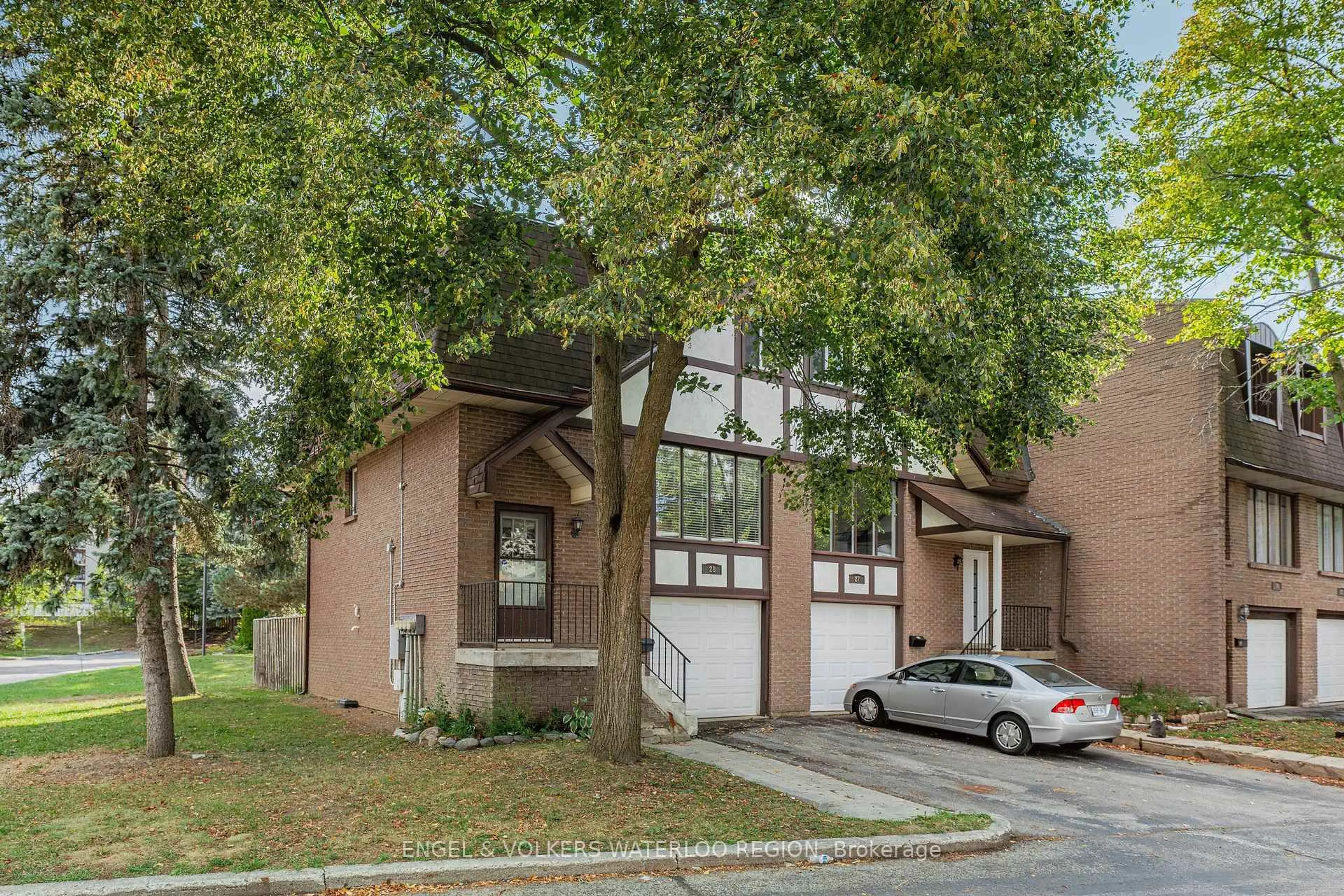 Home with brick exterior material, street for 49 Cedarwoods Cres #28, Kitchener Ontario N2C 2L1