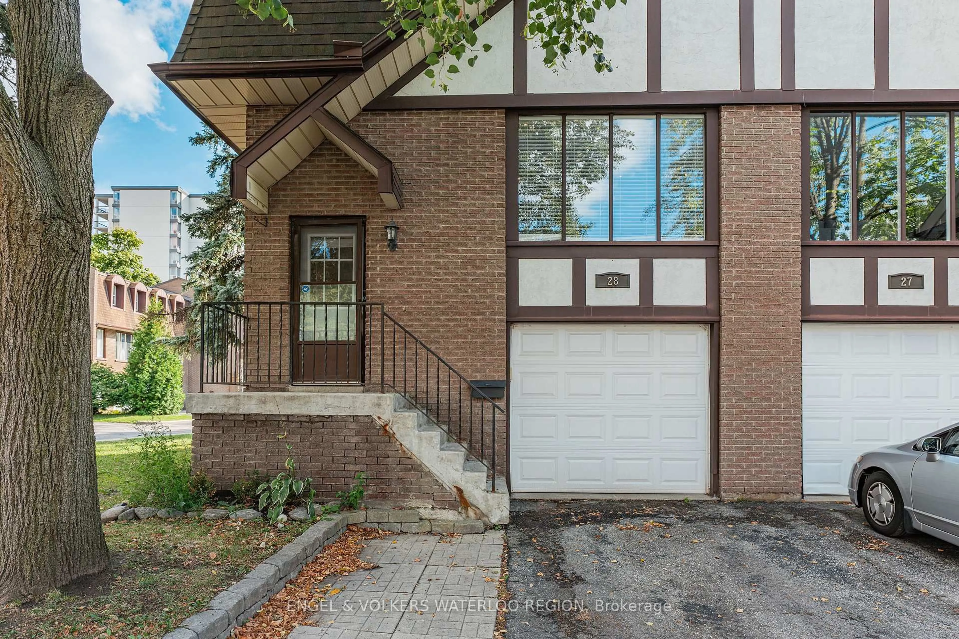 Home with brick exterior material, street for 49 Cedarwoods Cres #28, Kitchener Ontario N2C 2L1