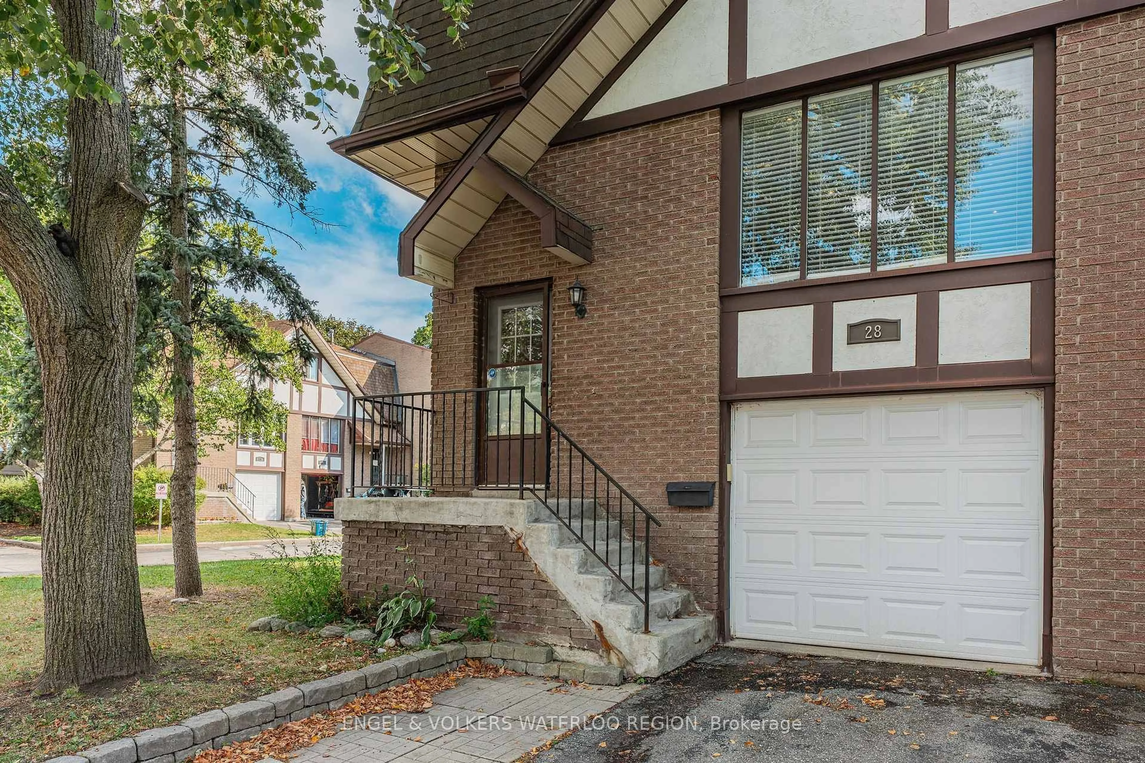 Home with brick exterior material, street for 49 Cedarwoods Cres #28, Kitchener Ontario N2C 2L1