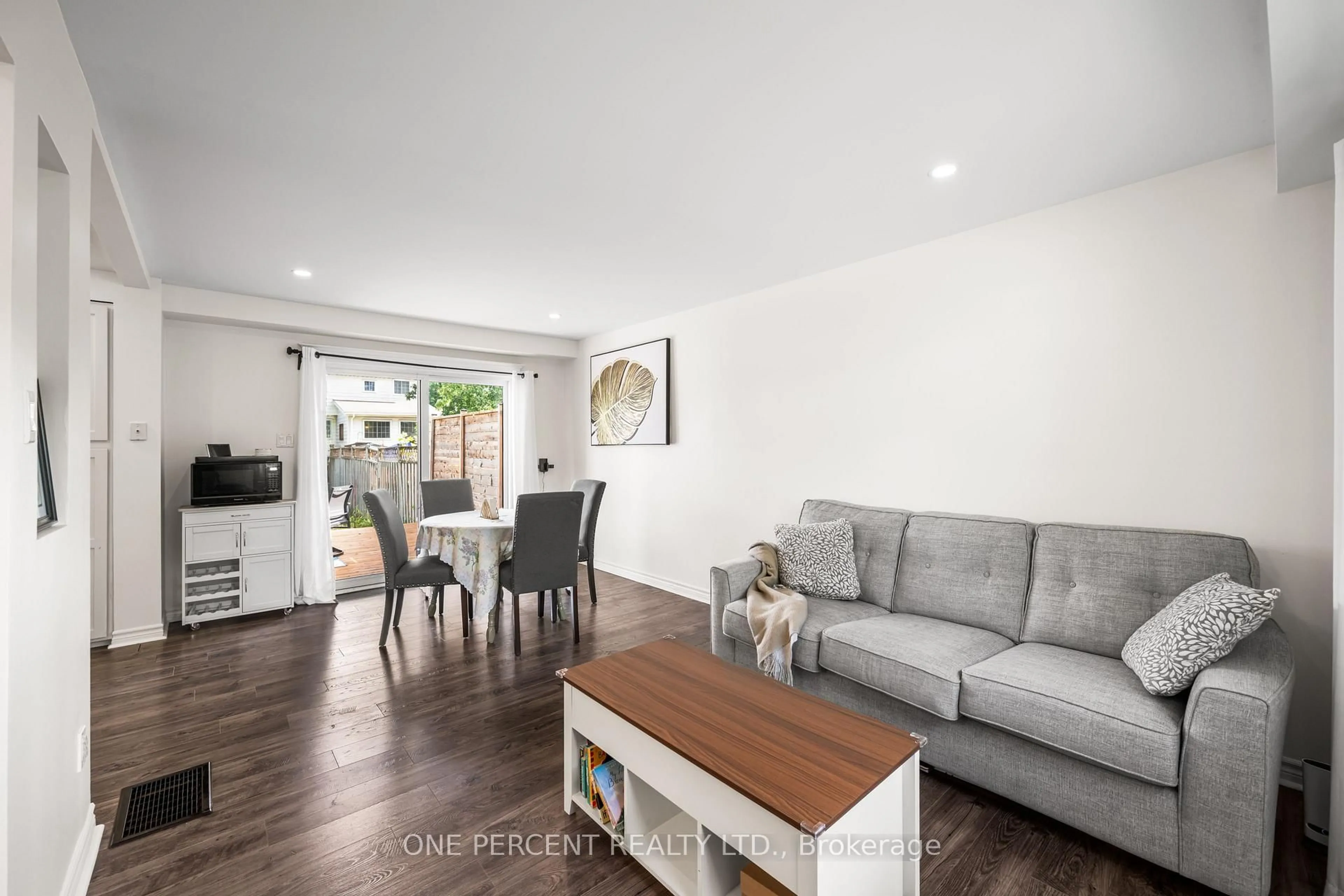 Living room with furniture, wood/laminate floor for 16 Shouldice Cres, Ottawa Ontario K2L 1M9
