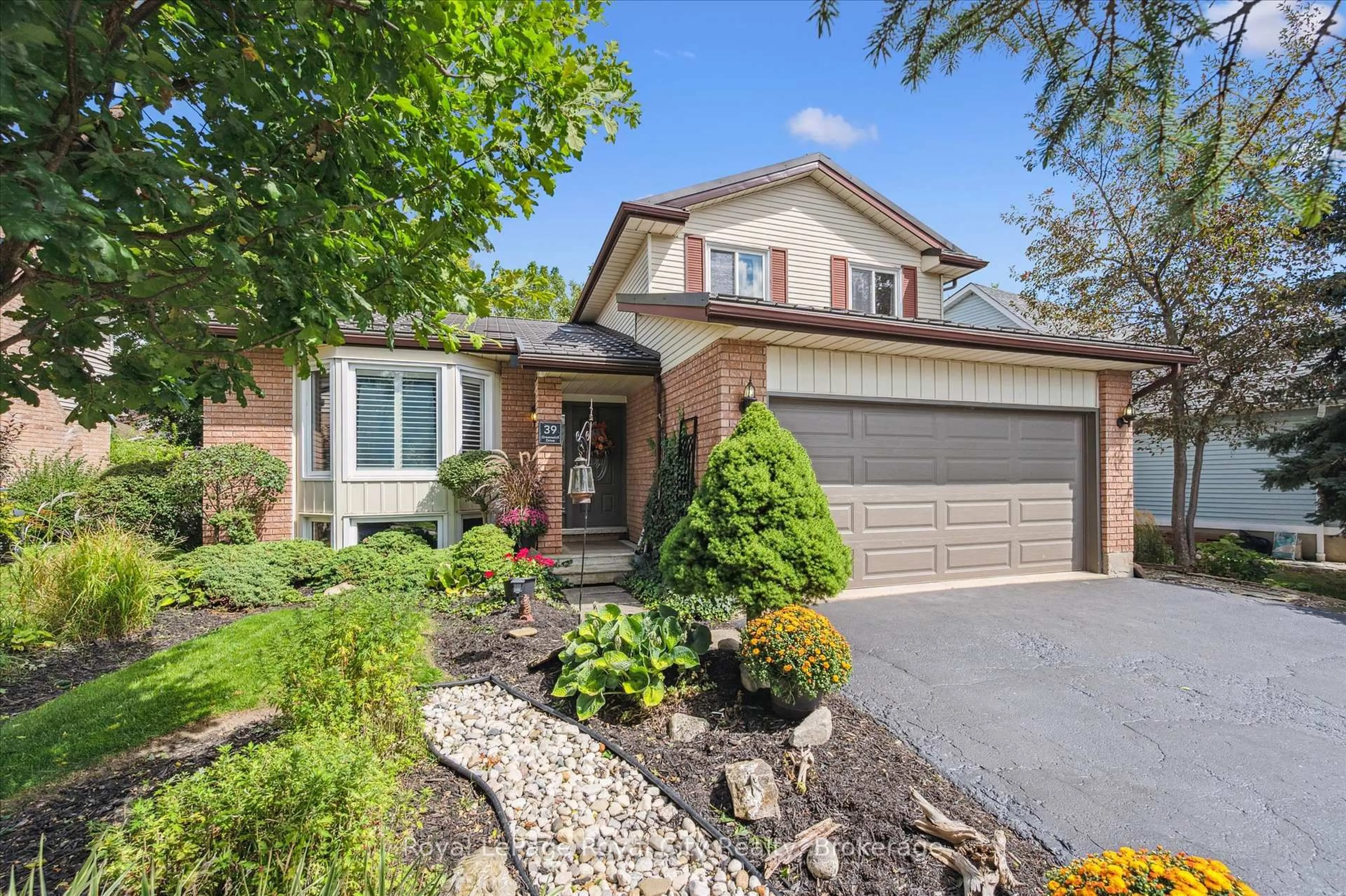 Home with brick exterior material, street for 39 Greenwich Dr, Guelph Ontario N1H 8C5