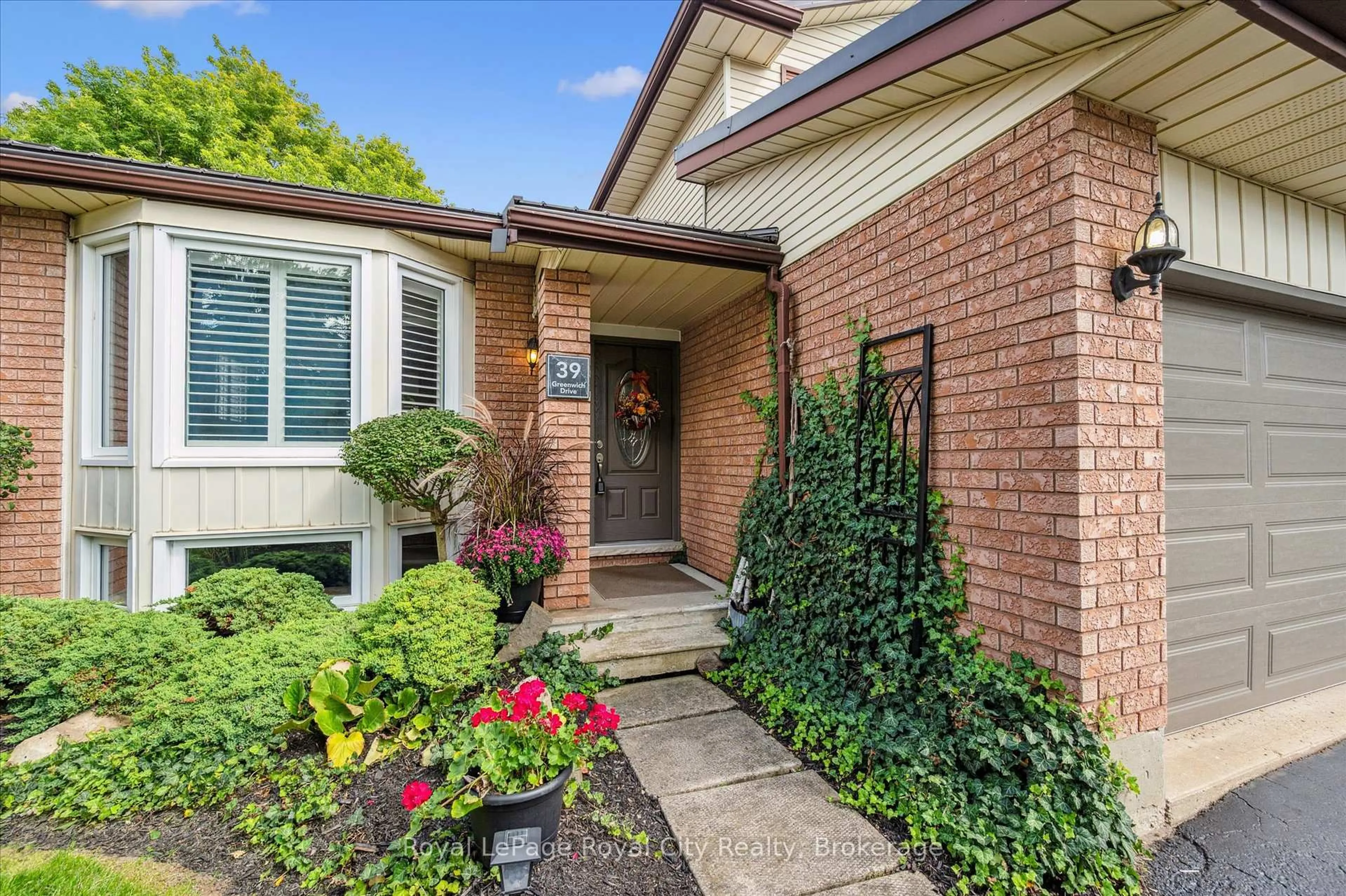 Home with brick exterior material, street for 39 Greenwich Dr, Guelph Ontario N1H 8C5