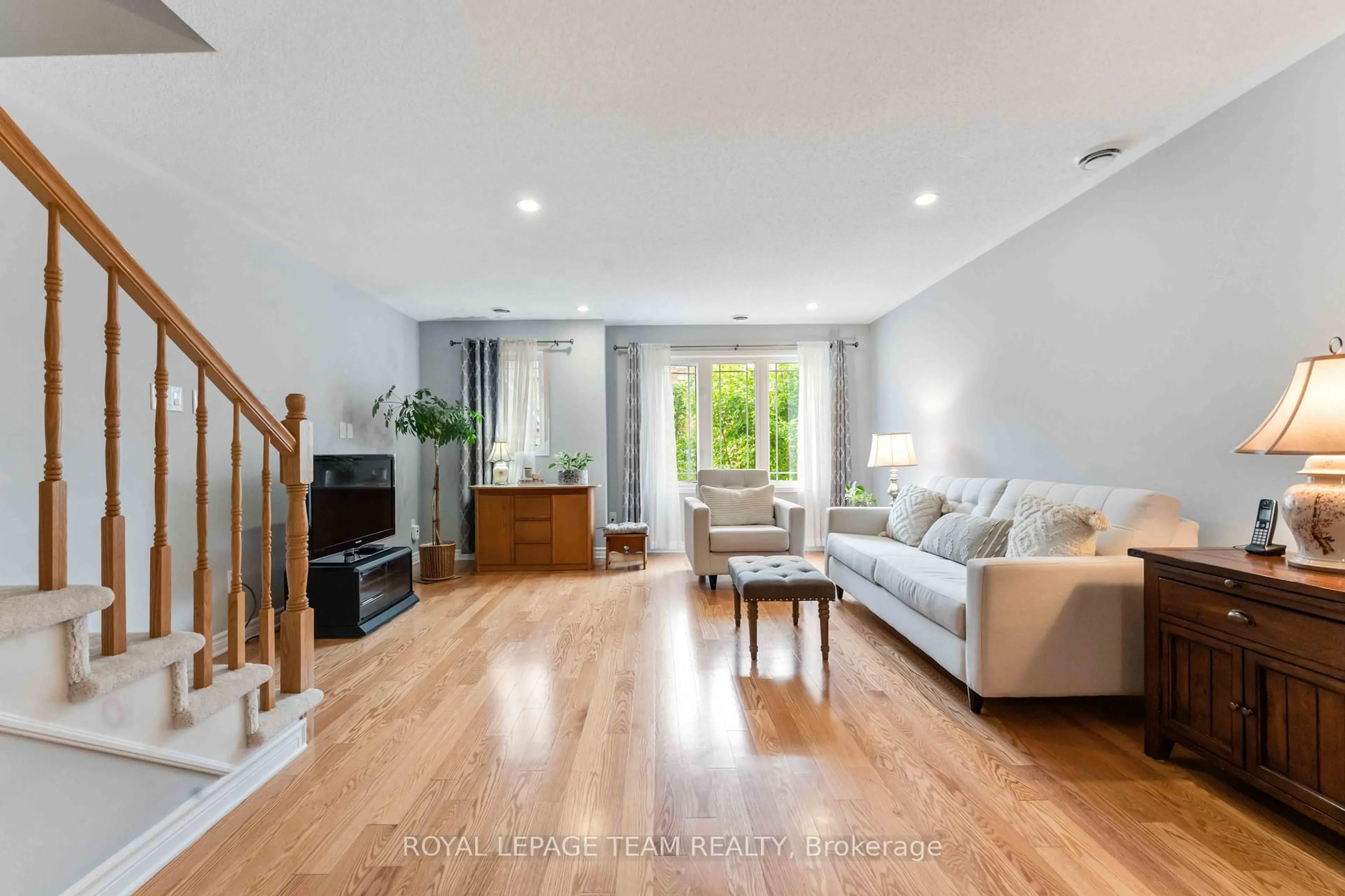 Living room with furniture, wood/laminate floor for 422 Leboutillier Ave, Ottawa Ontario K1K 2V7