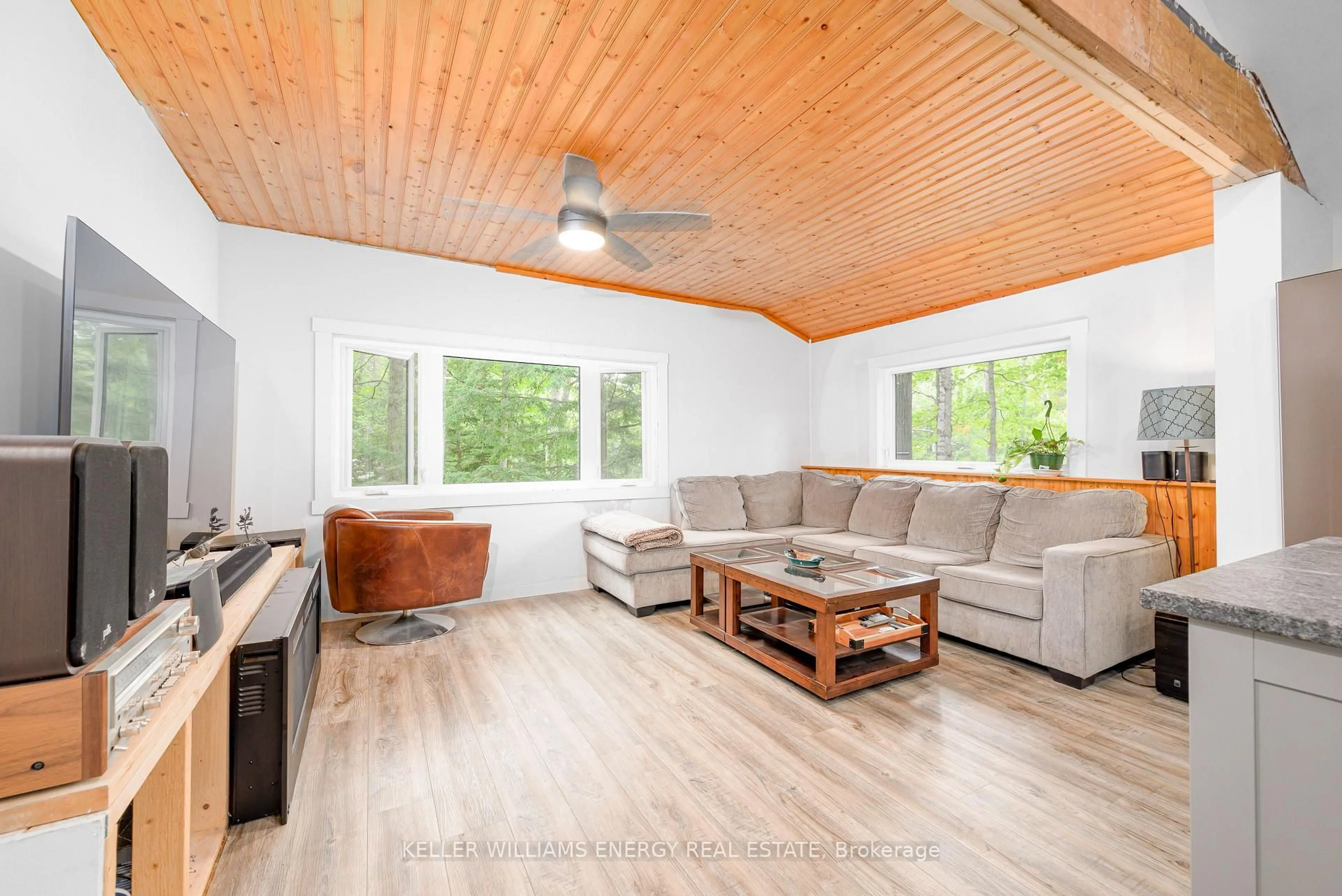 Living room with furniture, wood/laminate floor for 260 Edwina Dr, Trent Lakes Ontario K0M 1A0