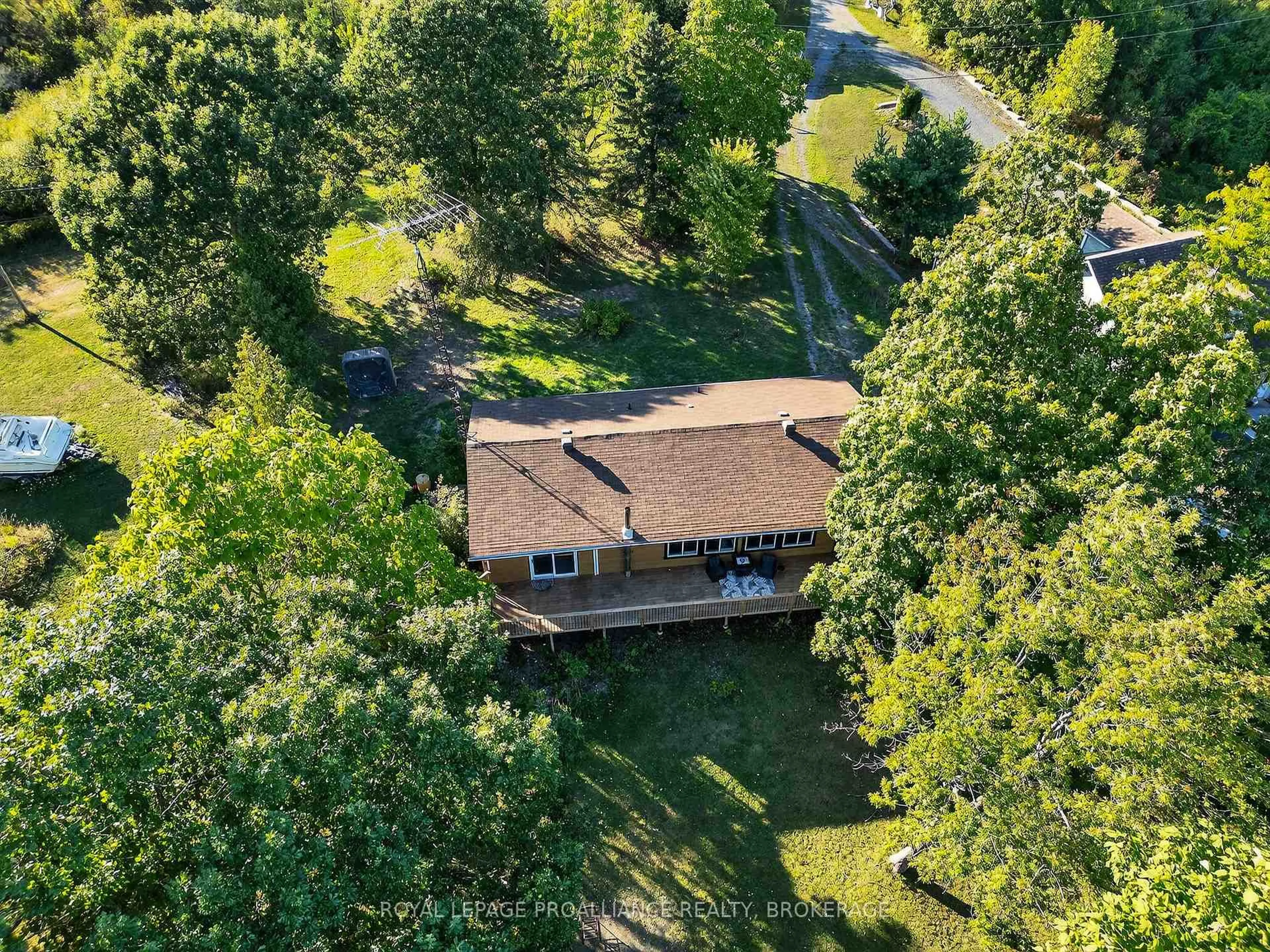 A pic from outside/outdoor area/front of a property/back of a property/a pic from drone, forest/trees view for 225 Johnson Bay Lane, Gananoque Ontario K7G 2V6