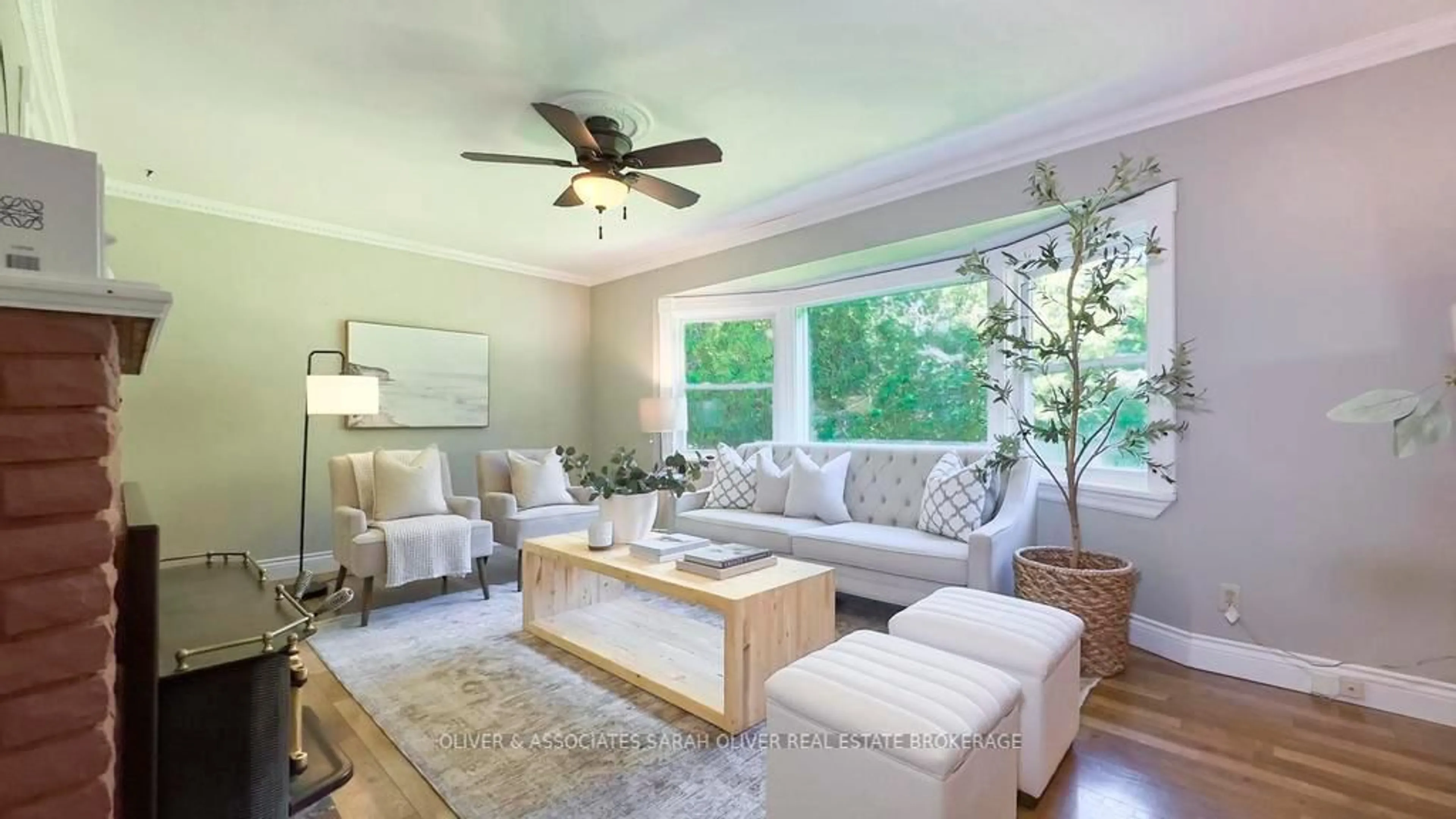 Living room with furniture, wood/laminate floor for 2487 Oxford St, London South Ontario N6K 4P1