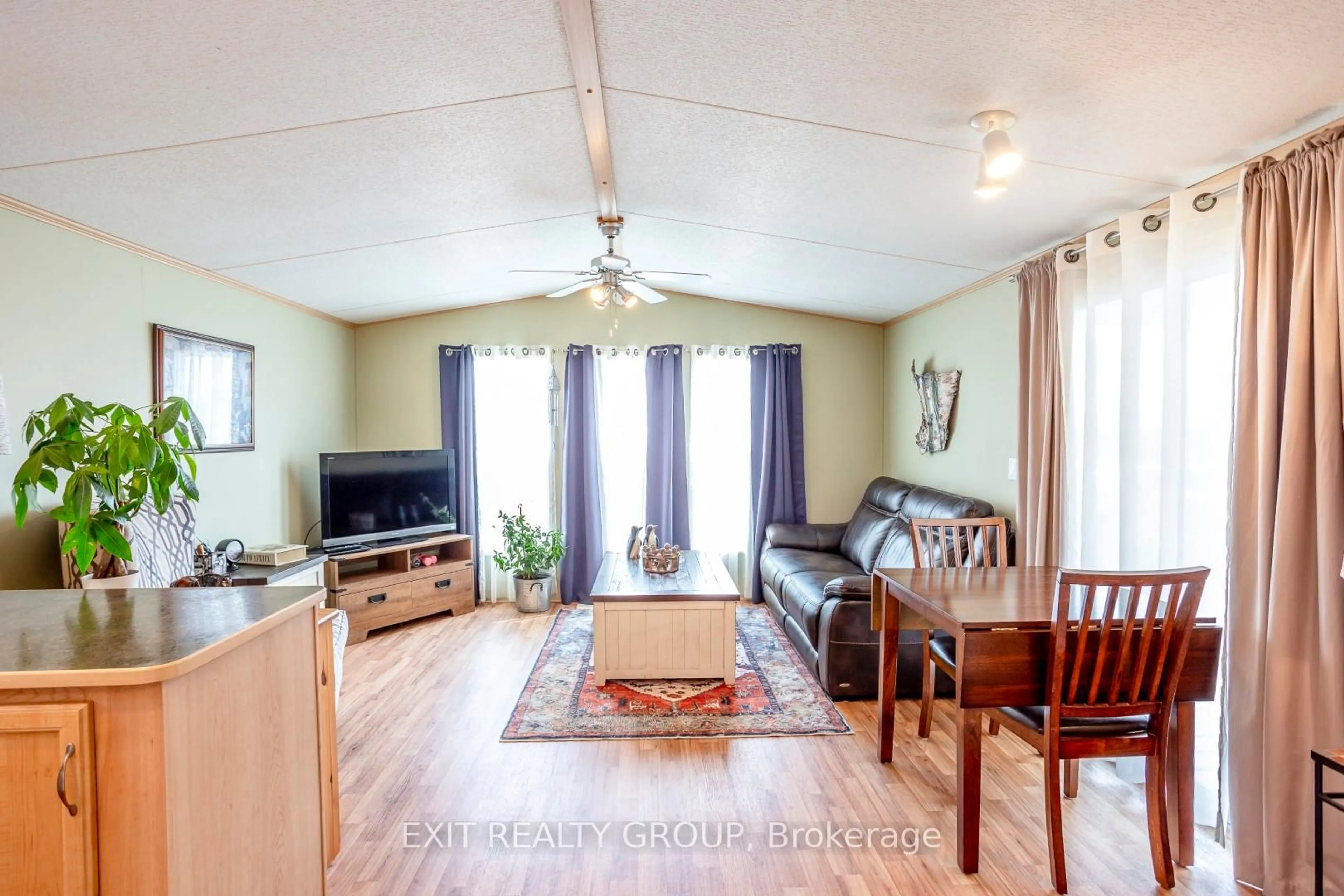 Living room with furniture, wood/laminate floor for 153 County Road 27 ##D9, Prince Edward County Ontario K0K 1T0