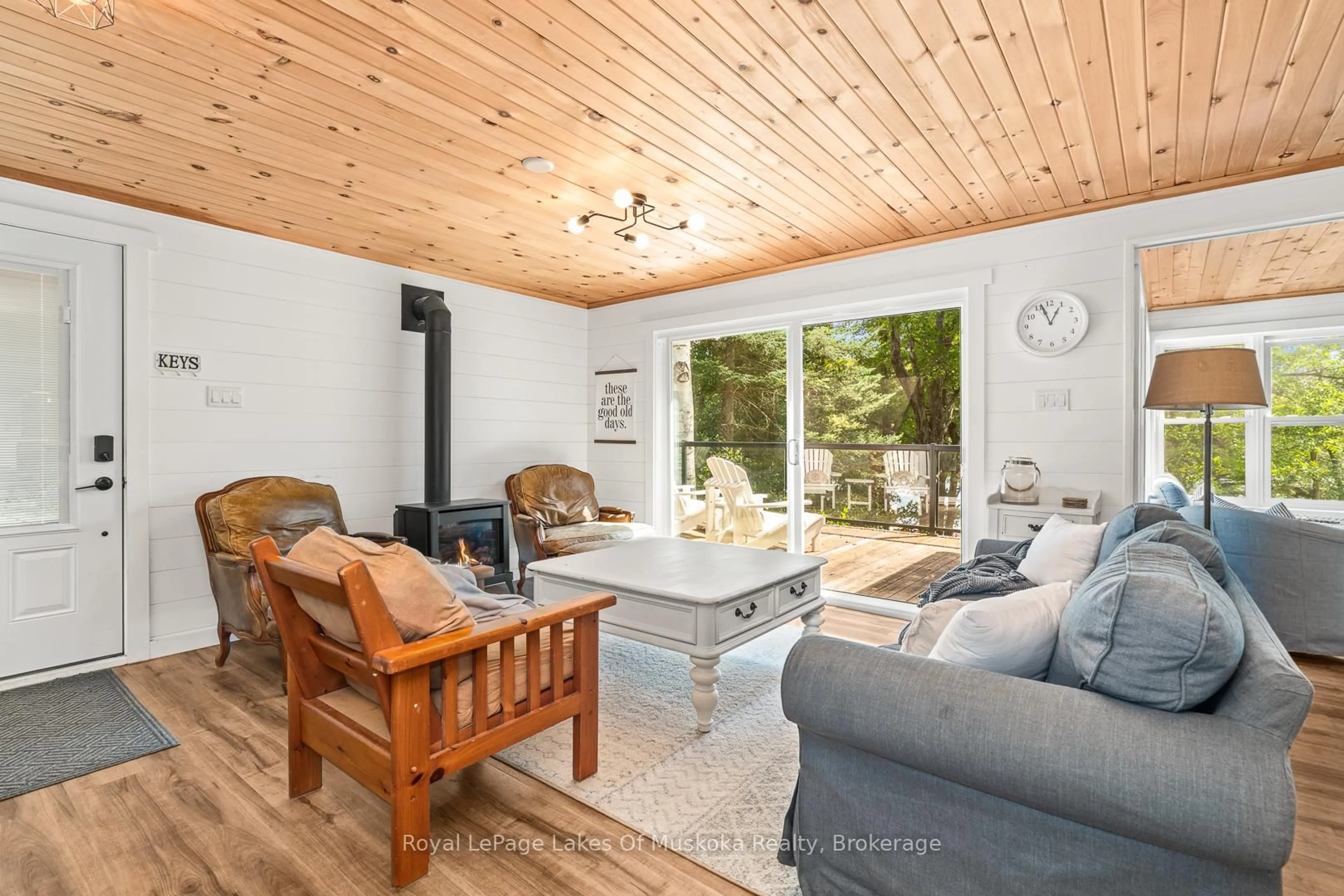 Living room with furniture, wood/laminate floor for 1341 Billie Bear Rd, Lake of Bays Ontario P1H 2J6