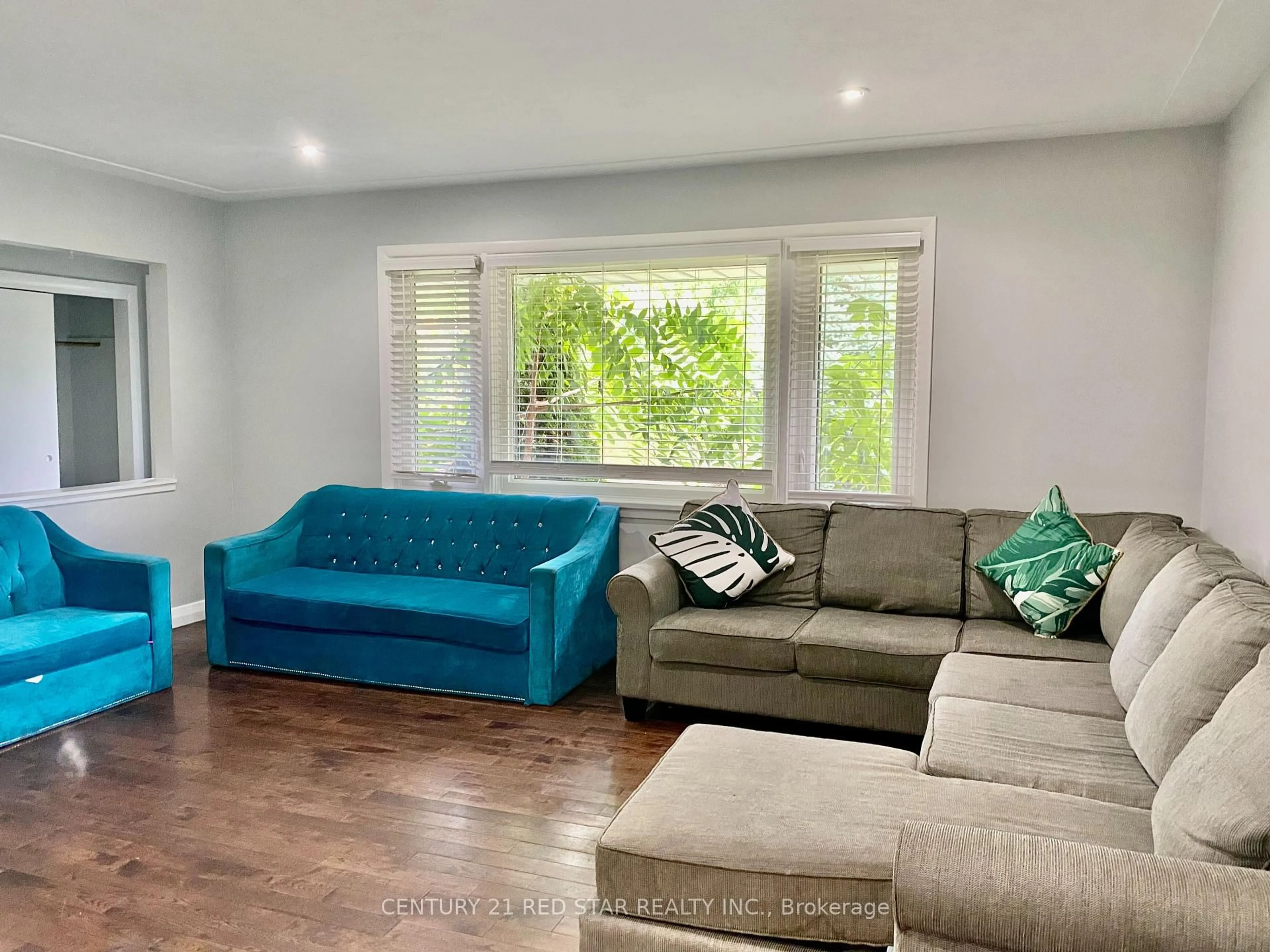 Living room with furniture, wood/laminate floor for 107 Ellis Cres, Waterloo Ontario N2J 2C1