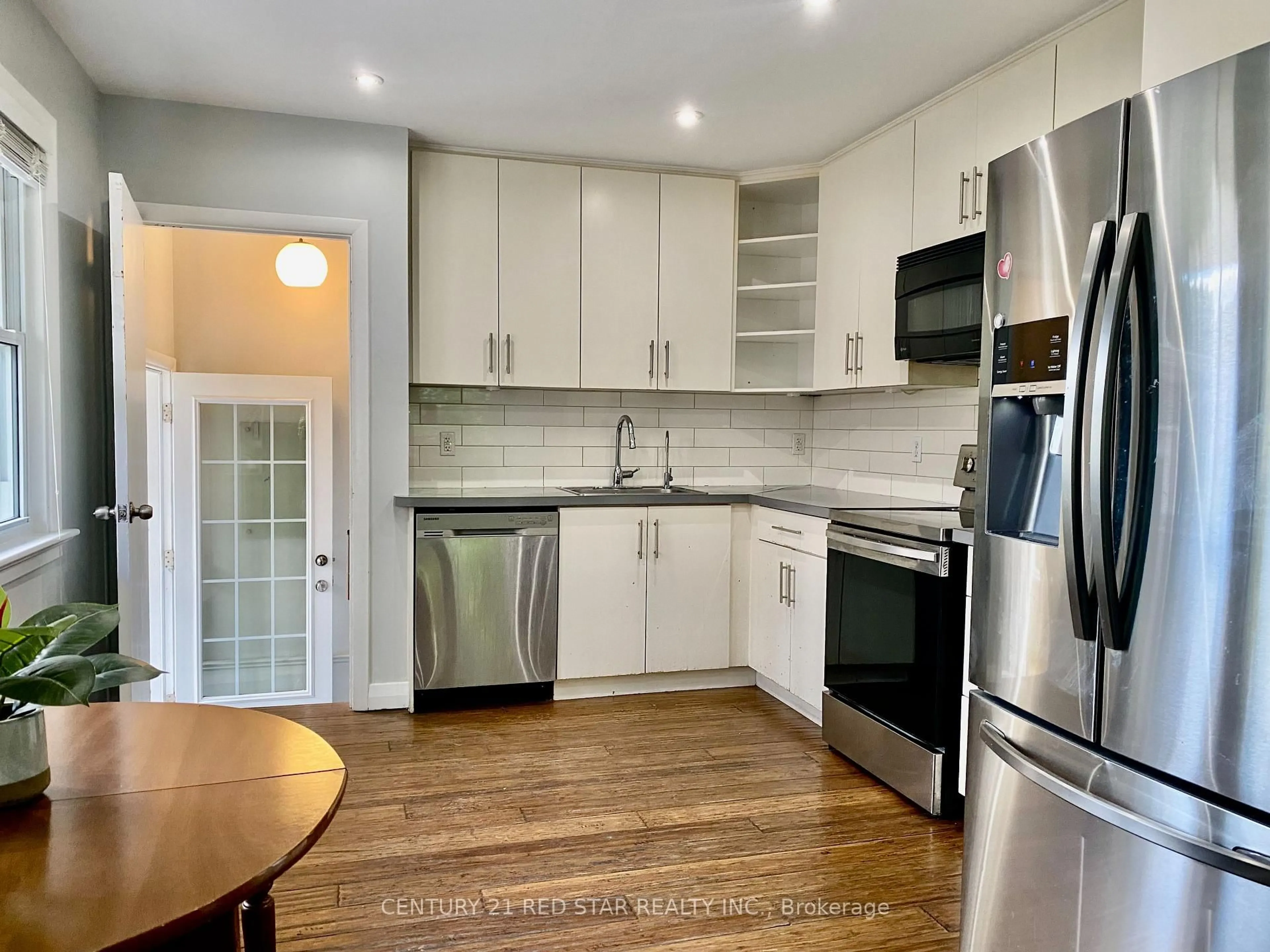 Open concept kitchen, wood/laminate floor for 107 Ellis Cres, Waterloo Ontario N2J 2C1