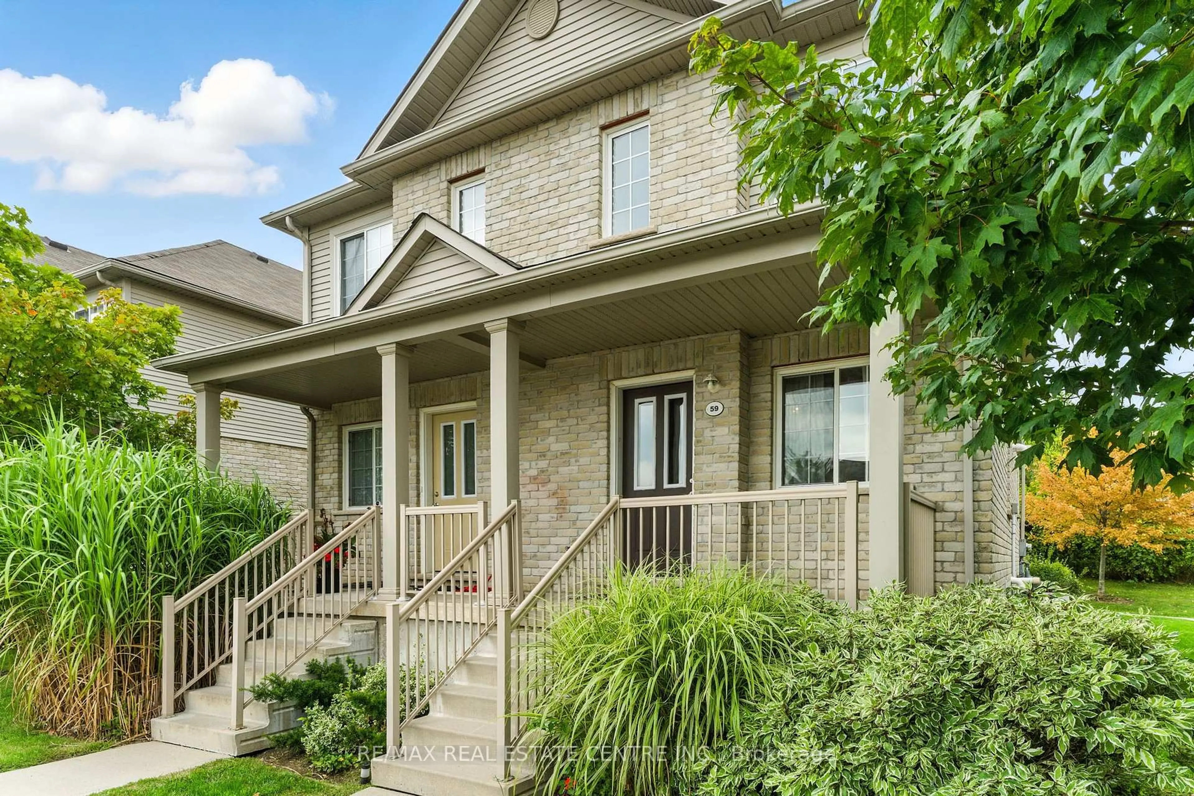 Home with brick exterior material, street for 35 Mountford Dr #59, Guelph Ontario N1E 0G6