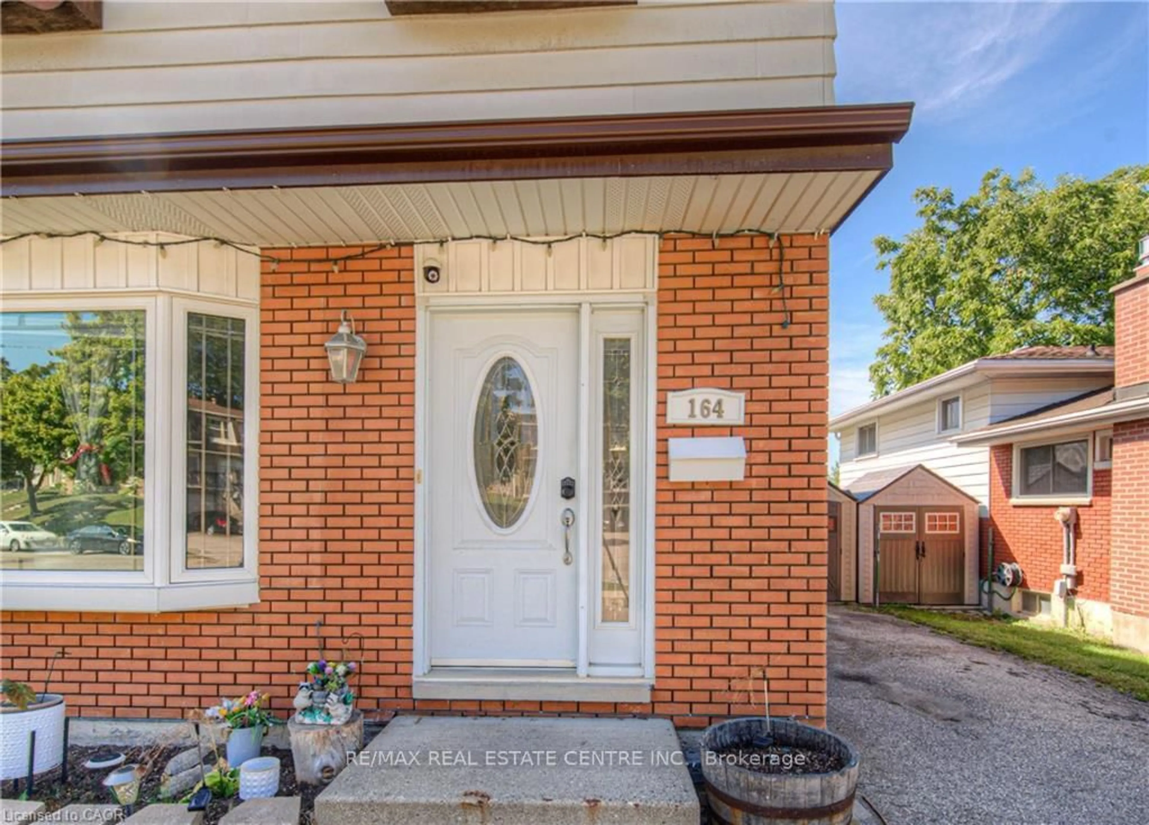 Home with brick exterior material, street for 164 Green Valley Dr, Kitchener Ontario N2P 1C4
