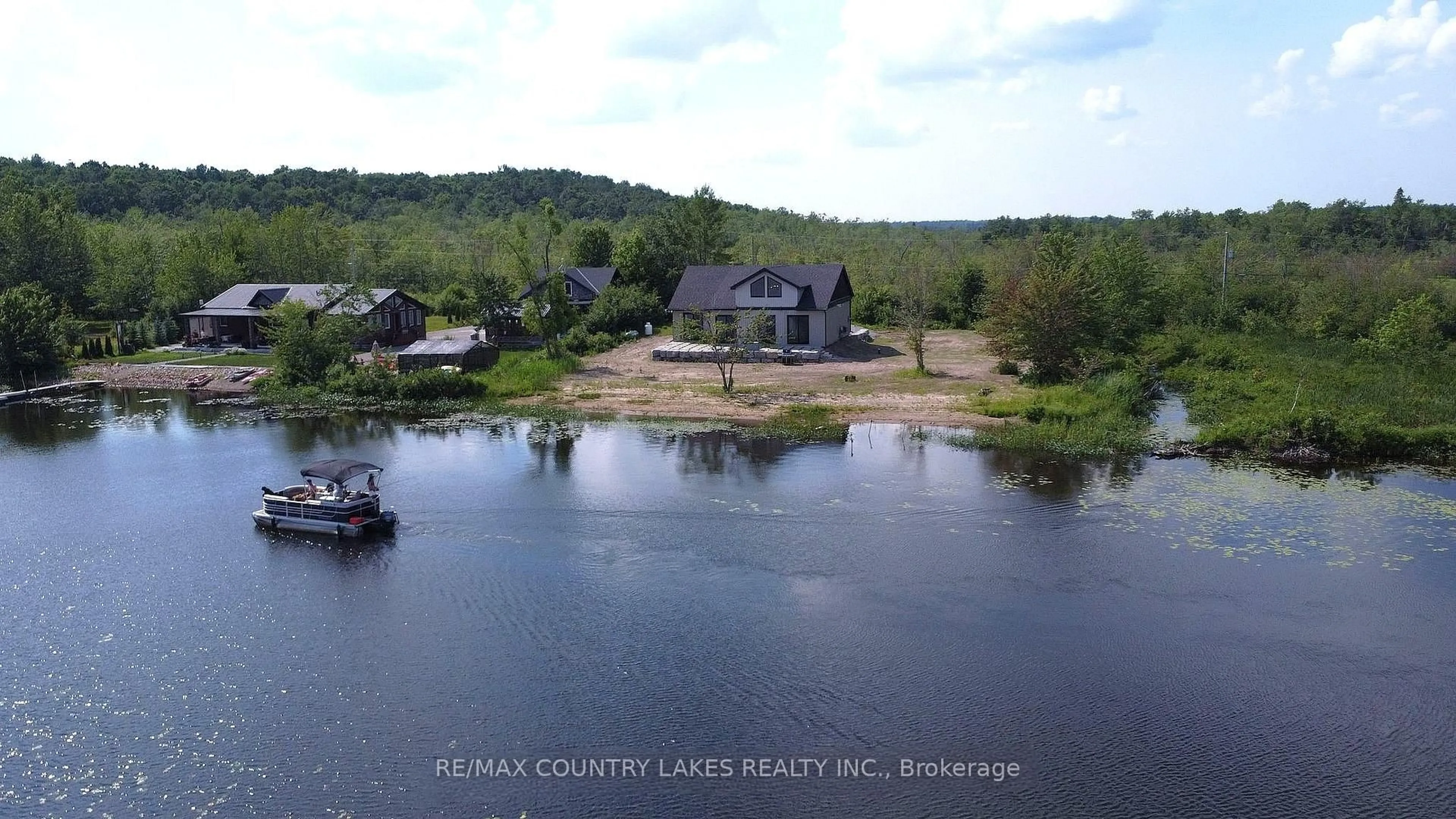 A pic from outside/outdoor area/front of a property/back of a property/a pic from drone, water/lake/river/ocean view for 130 Baker Blvd, Kawartha Lakes Ontario K0M 2B0
