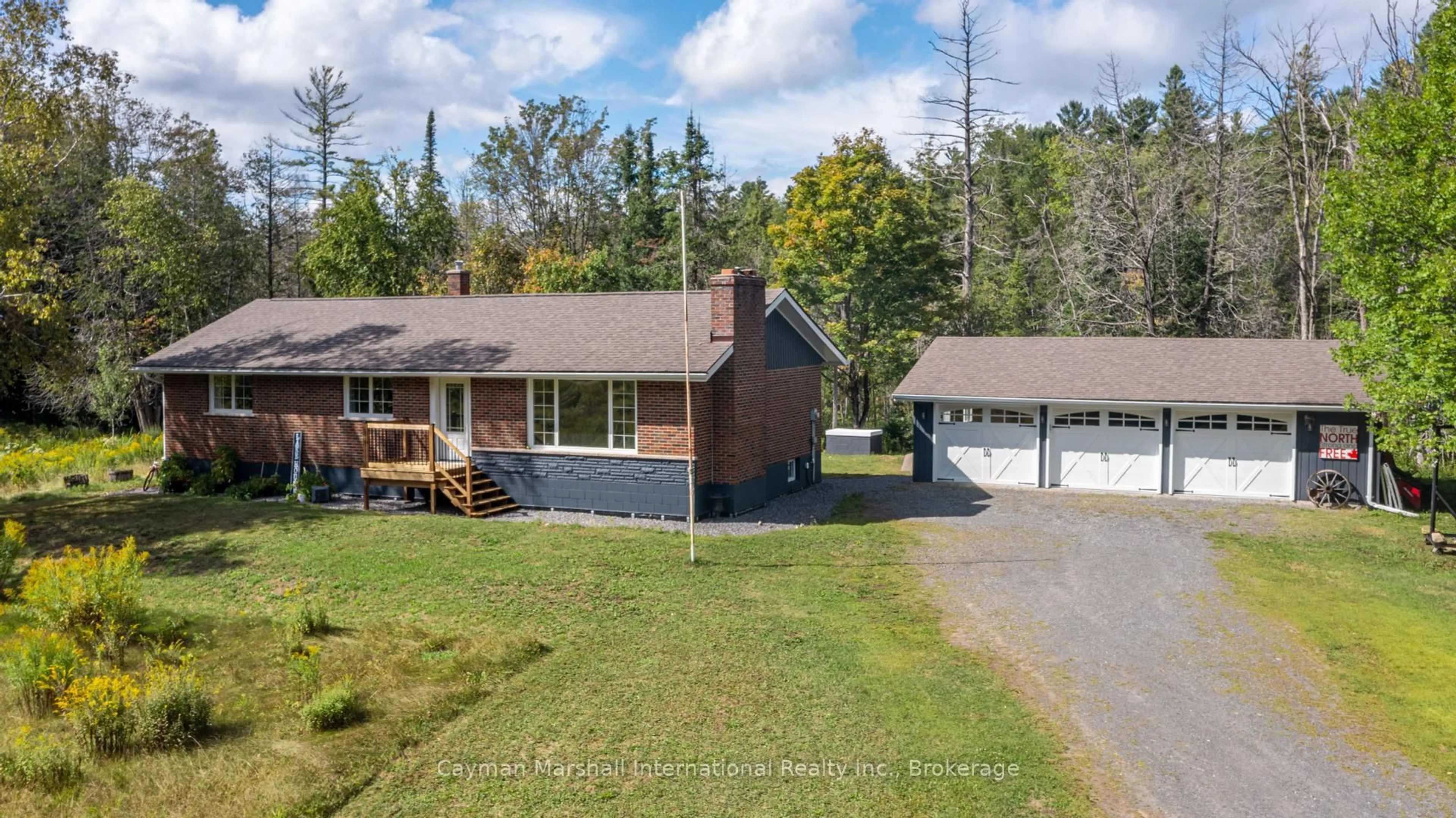 A pic from outside/outdoor area/front of a property/back of a property/a pic from drone, street for 2900 Muskoka Road 10, Huntsville Ontario P1H 2J3