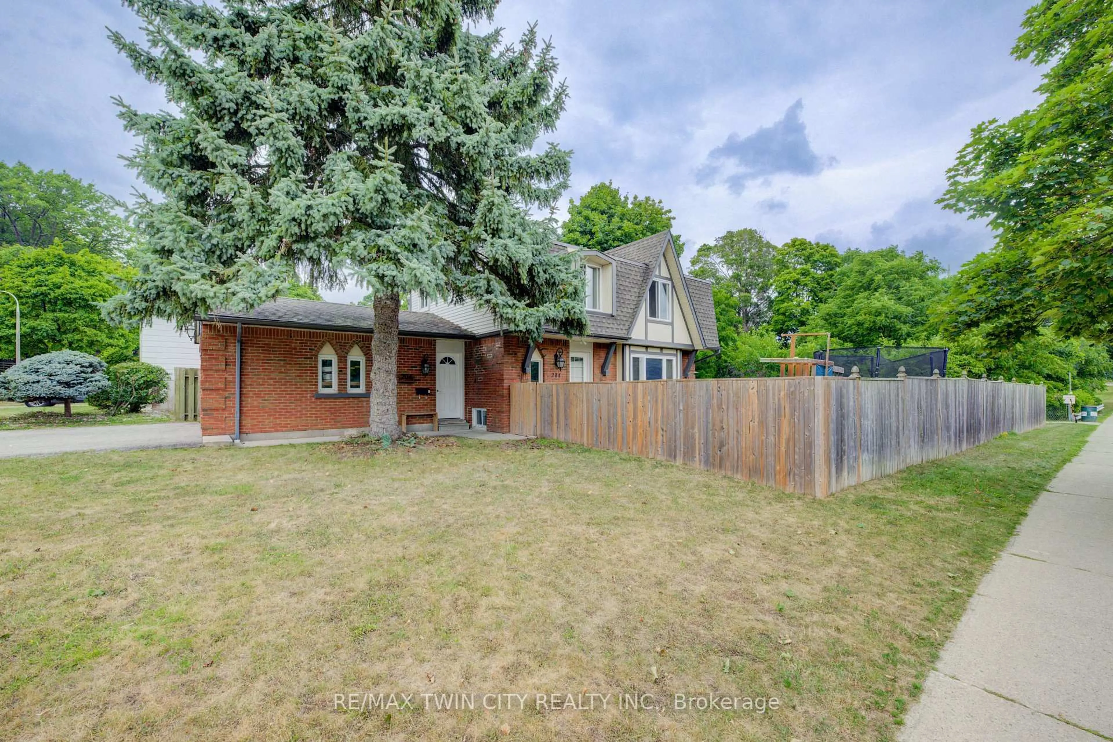 Home with brick exterior material, street for 204 Country Hill Dr, Kitchener Ontario N2E 1R6