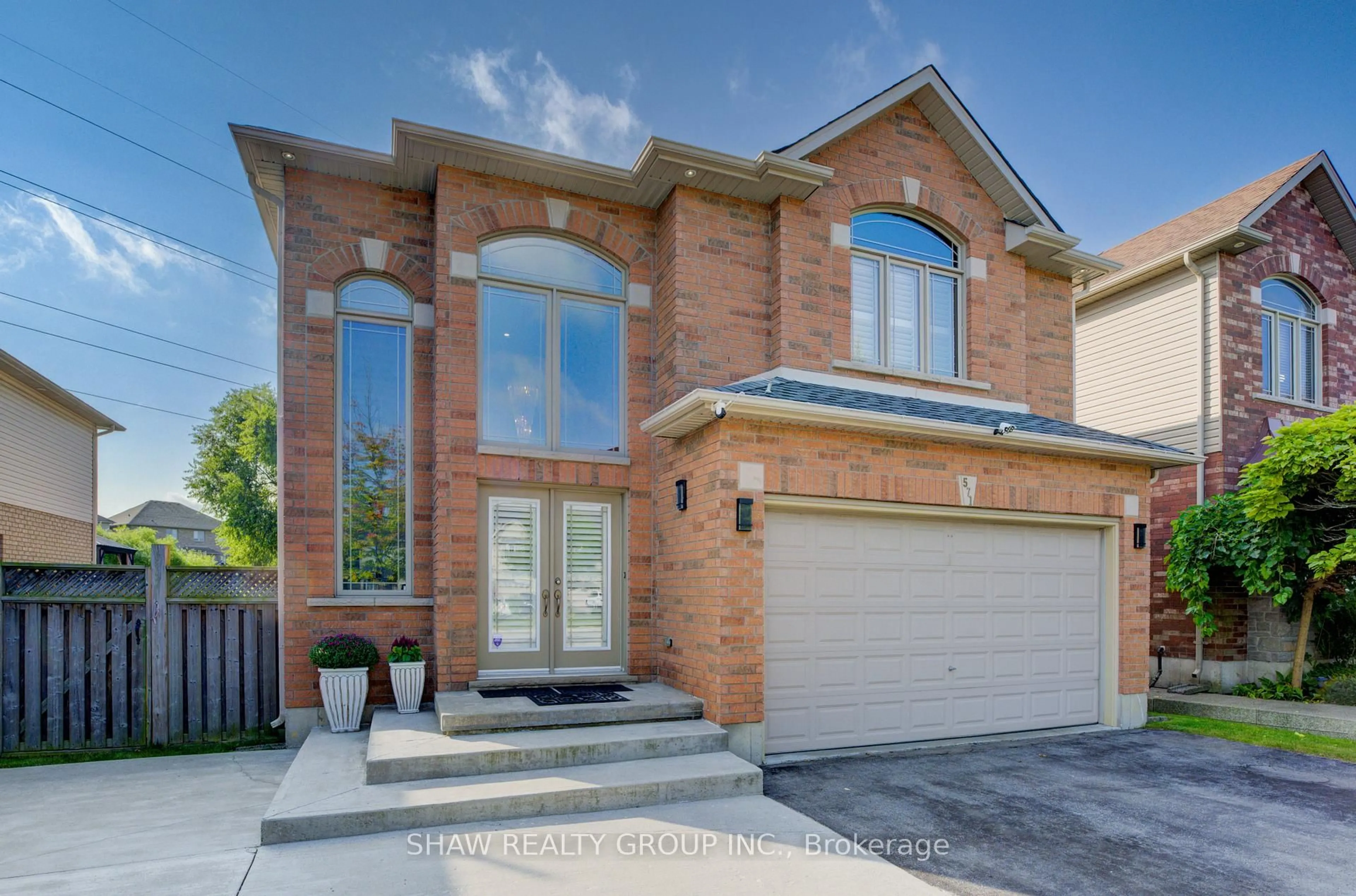 Home with brick exterior material, street for 571 Stonehenge Dr, Hamilton Ontario L9K 1T4