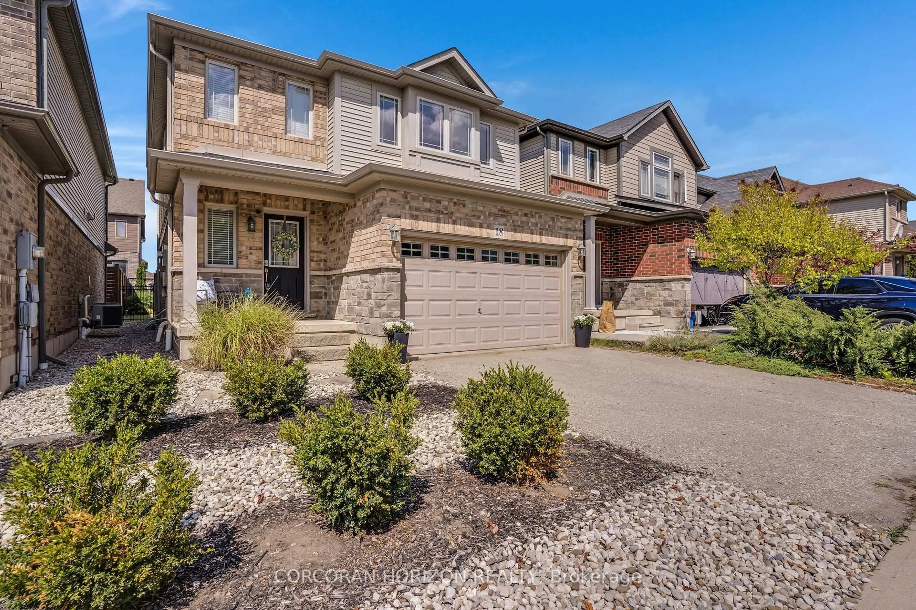 Home with brick exterior material, street for 18 Creek Ridge St, Kitchener Ontario N2R 0B5