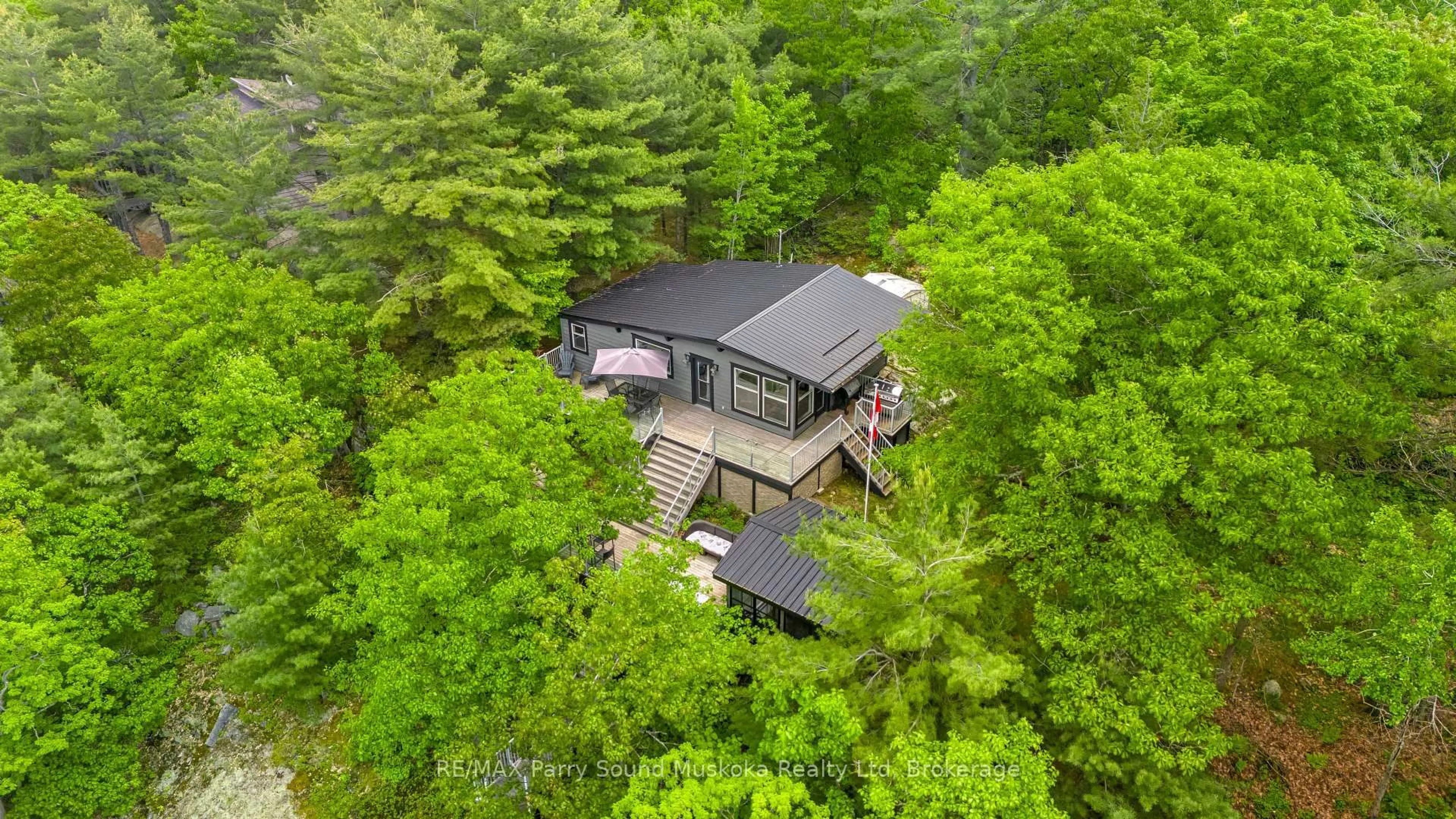A pic from outside/outdoor area/front of a property/back of a property/a pic from drone, forest/trees view for 109 Healey Lake, The Archipelago Ontario P0G 1G0