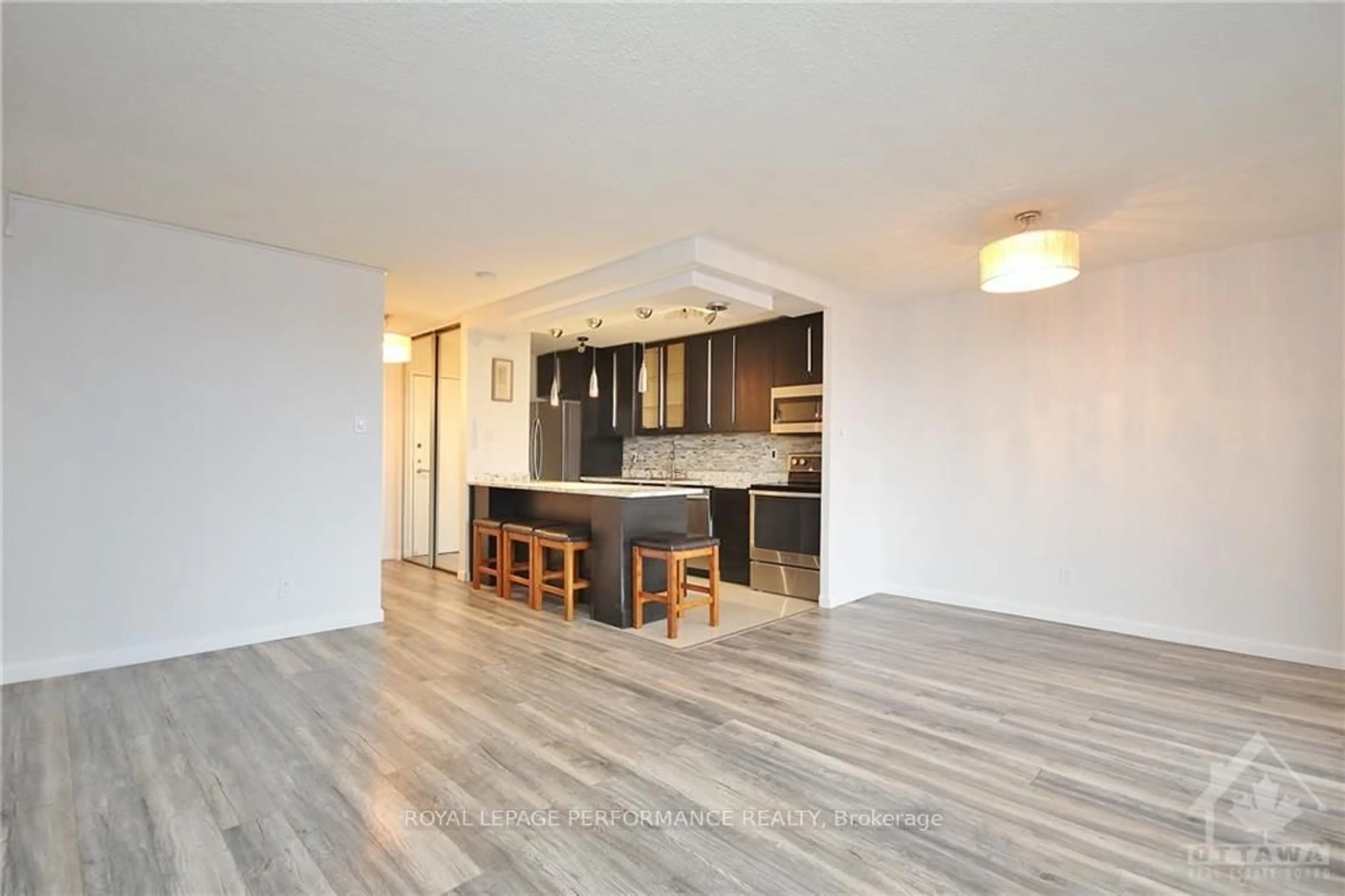 Open concept kitchen, wood/laminate floor for 1785 Frobisher Lane #1102, Ottawa Ontario K1G 3T7