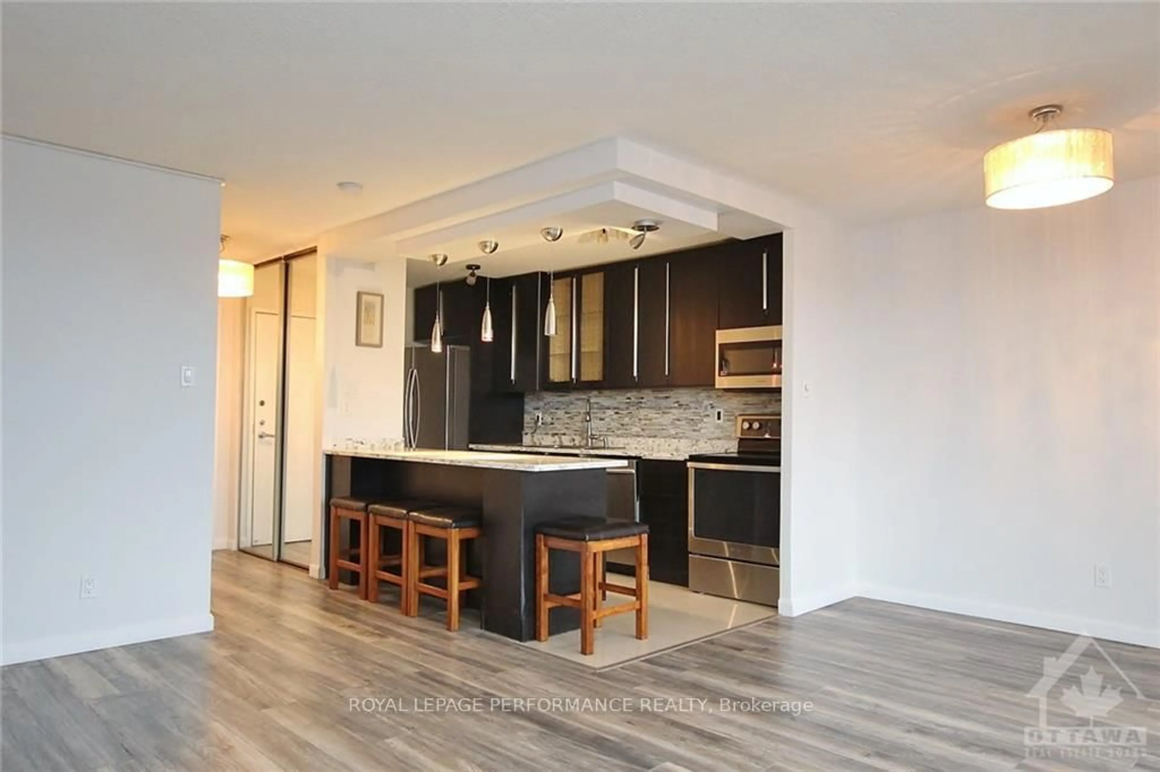 Open concept kitchen, wood/laminate floor for 1785 Frobisher Lane #1102, Ottawa Ontario K1G 3T7