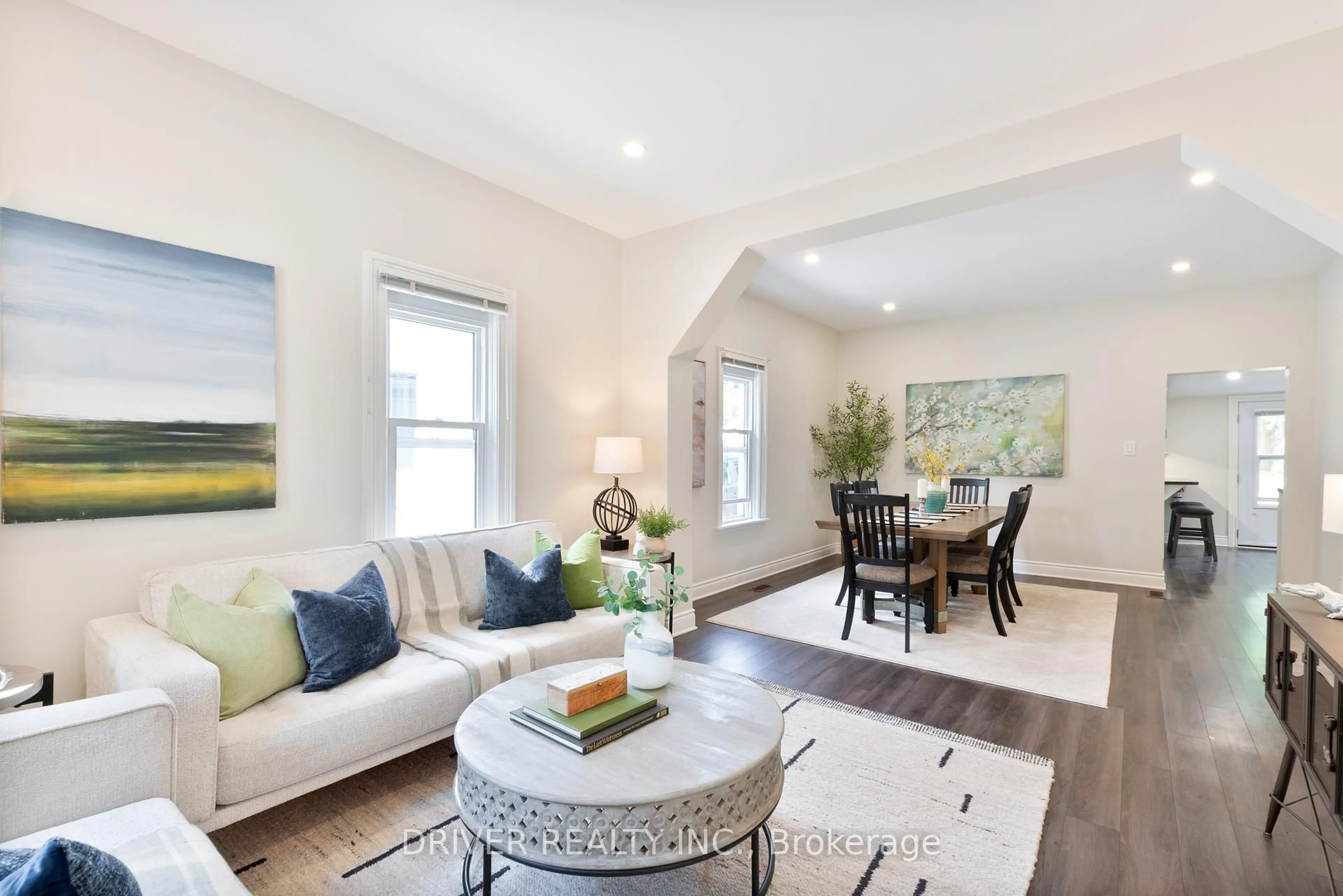 Living room with furniture, wood/laminate floor for 91 Malakoff St, St. Thomas Ontario N5P 1M3