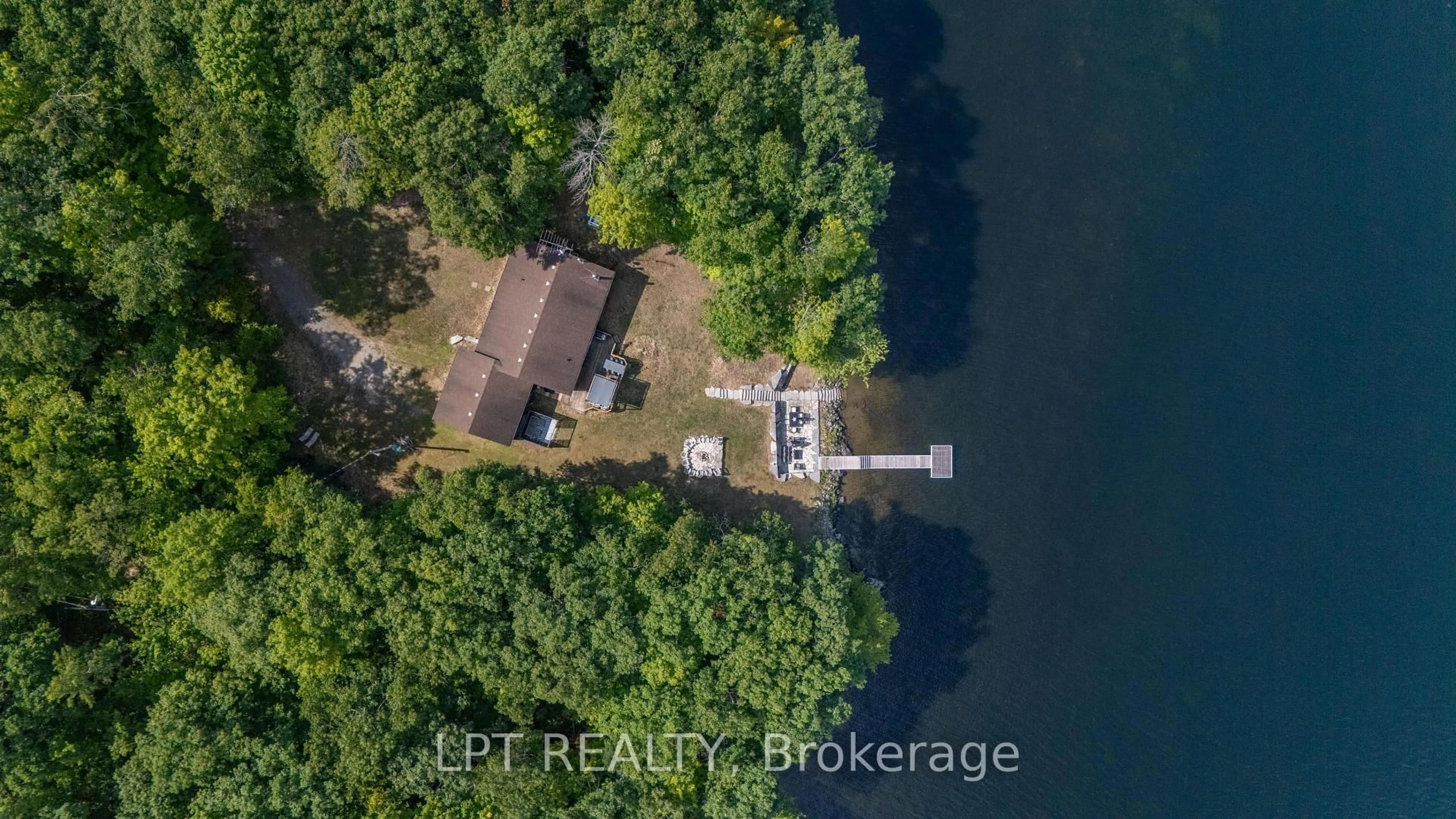 A pic from outside/outdoor area/front of a property/back of a property/a pic from drone, water/lake/river/ocean view for 79 Big Island Rd, Limoges Ontario K0K 2M0