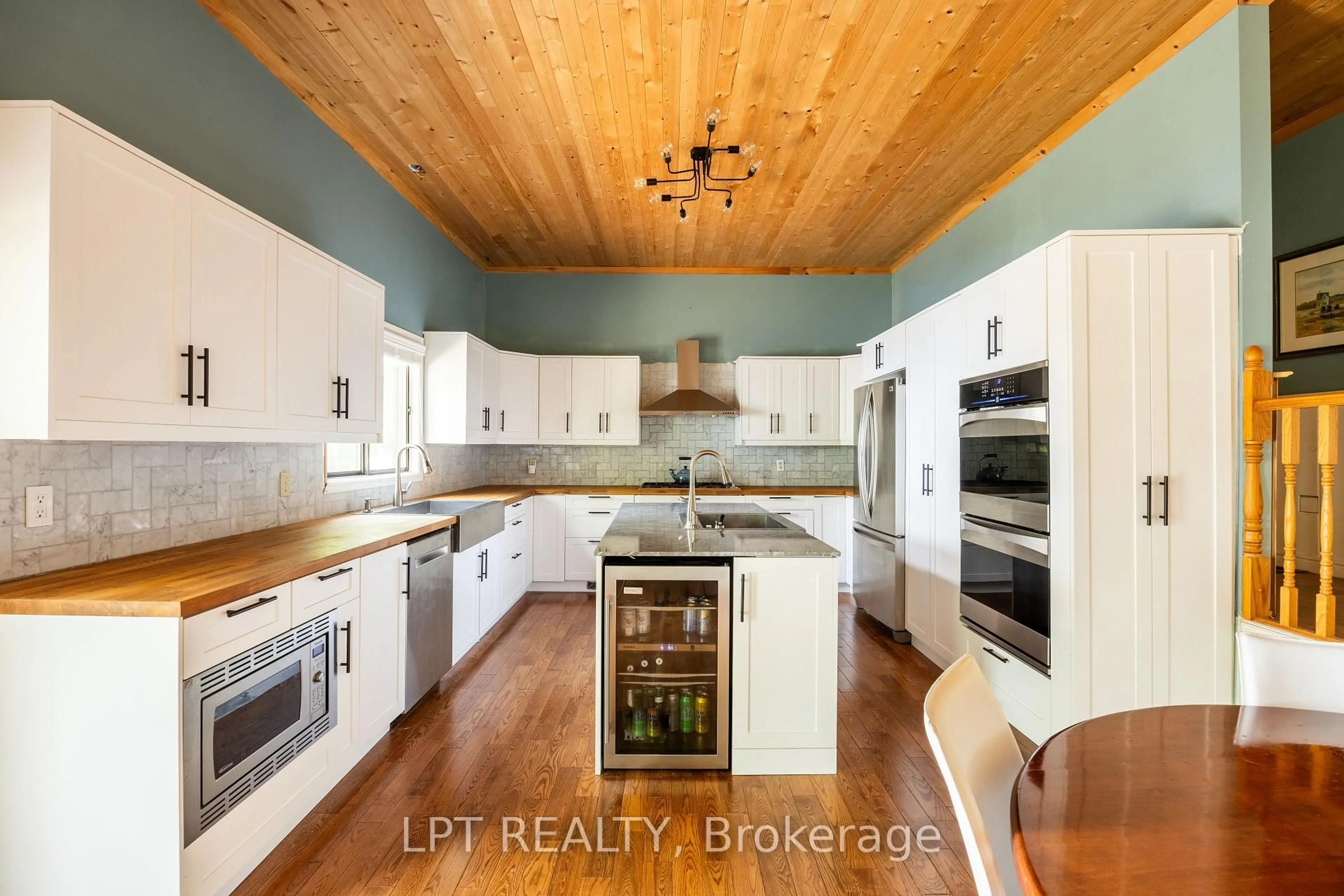 Open concept kitchen, wood/laminate floor for 79 Big Island Rd, Limoges Ontario K0K 2M0