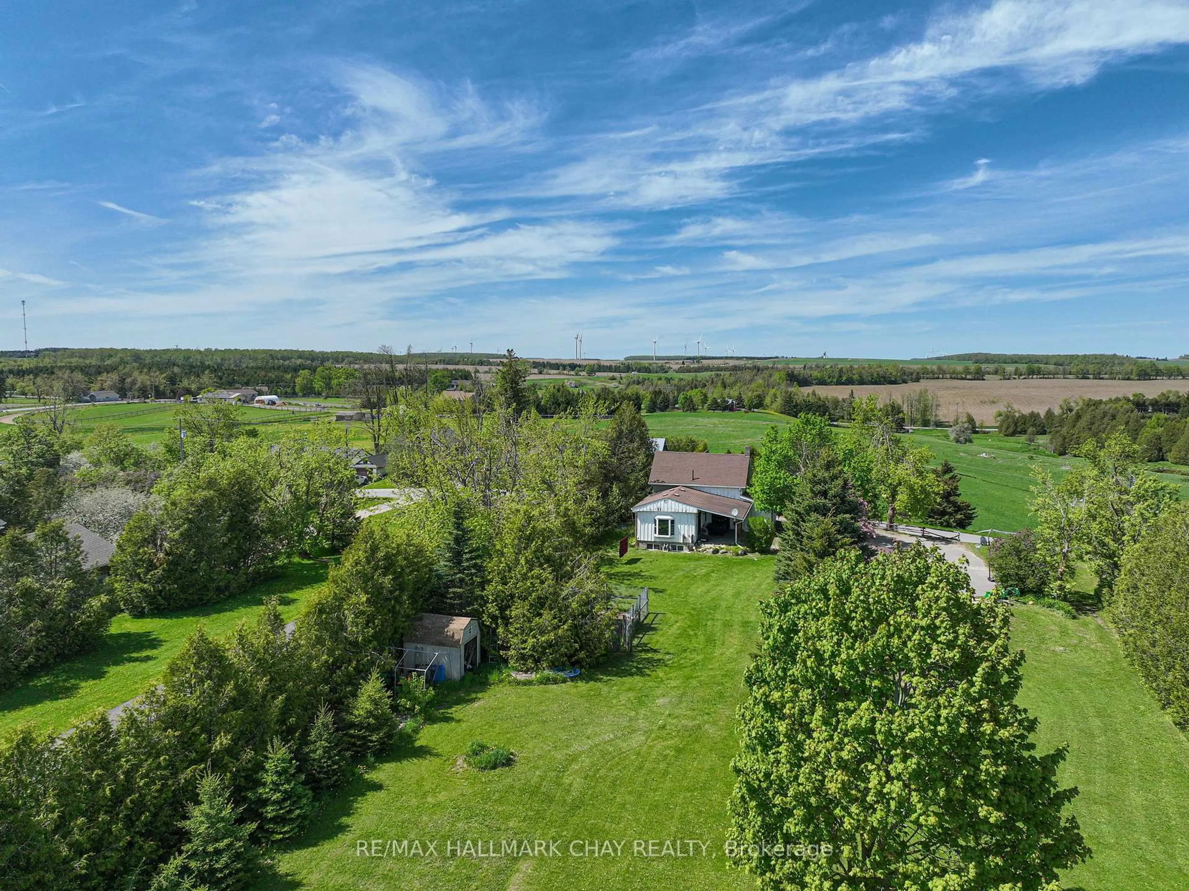 A pic from outside/outdoor area/front of a property/back of a property/a pic from drone, forest/trees view for 22 Mill Lane, Melancthon Ontario L9V 2T9