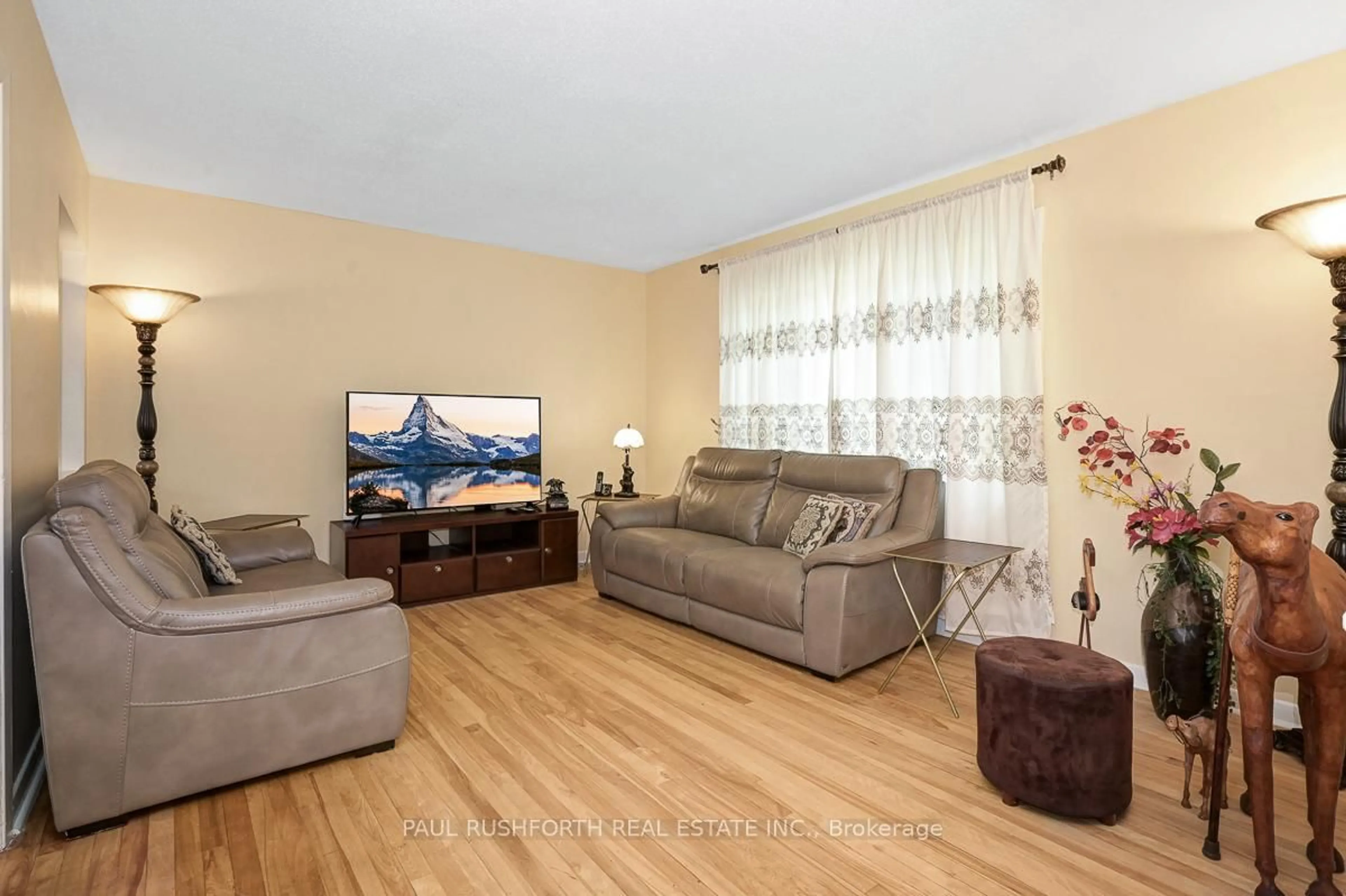 Living room with furniture, wood/laminate floor for 838 Borthwick Ave, Ottawa Ontario K1K 2M8