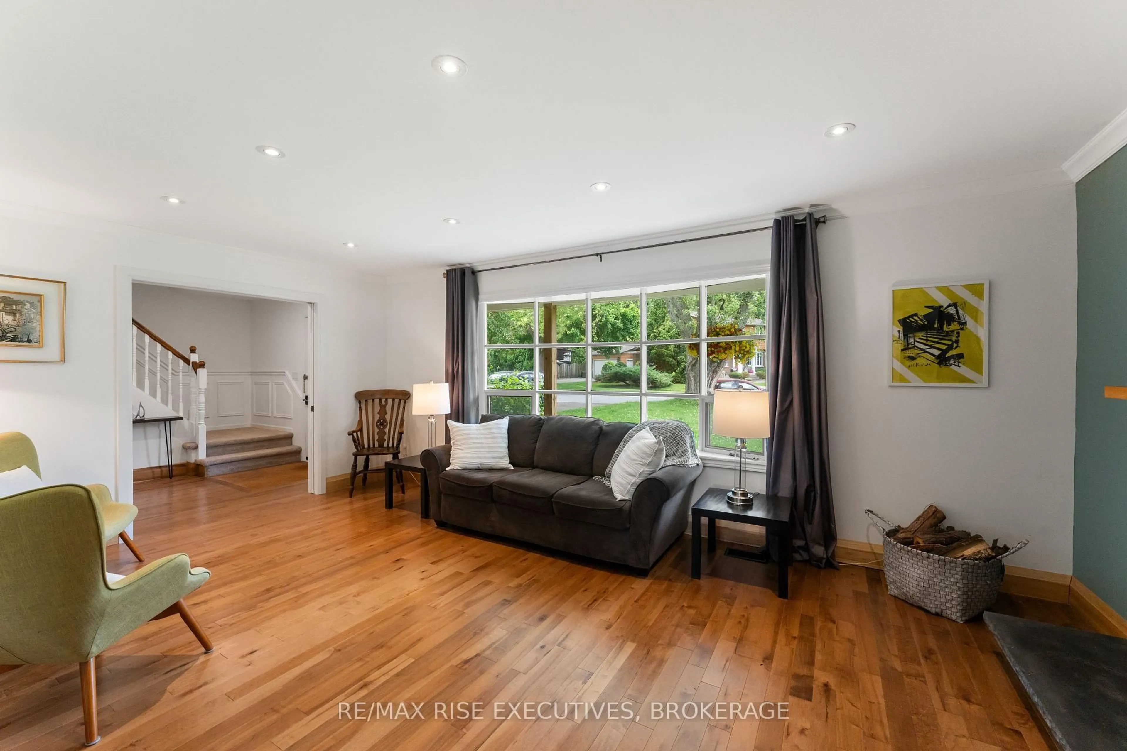 Living room with furniture, wood/laminate floor for 115 Fairway Hill Cres, Kingston Ontario K7M 2B5