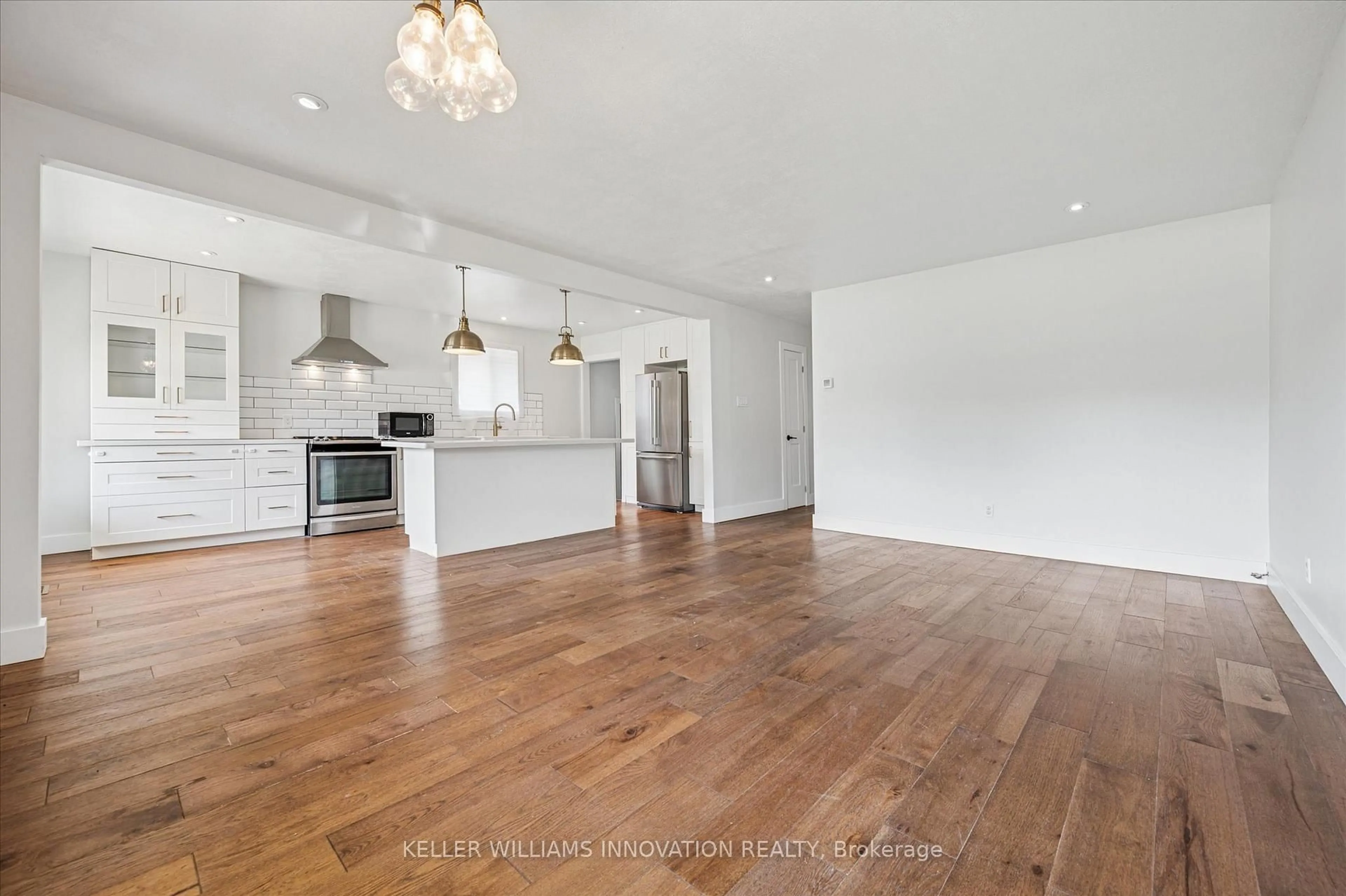 Open concept kitchen, wood/laminate floor for 79 Lorraine Dr, Cambridge Ontario N1R 6P2