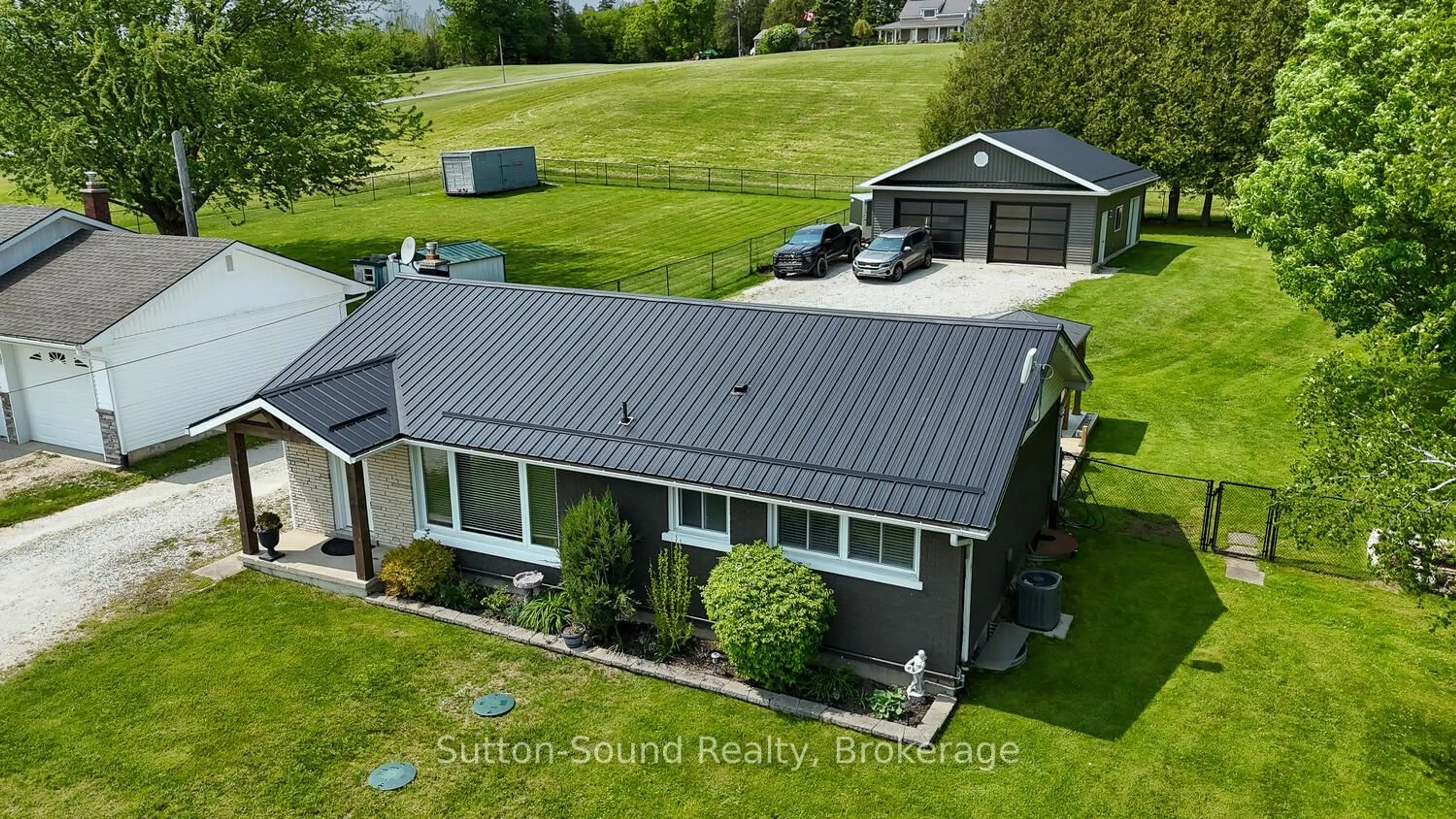 A pic from outside/outdoor area/front of a property/back of a property/a pic from drone, building for 202093 21 Highway, Georgian Bluffs Ontario N4K 5N7
