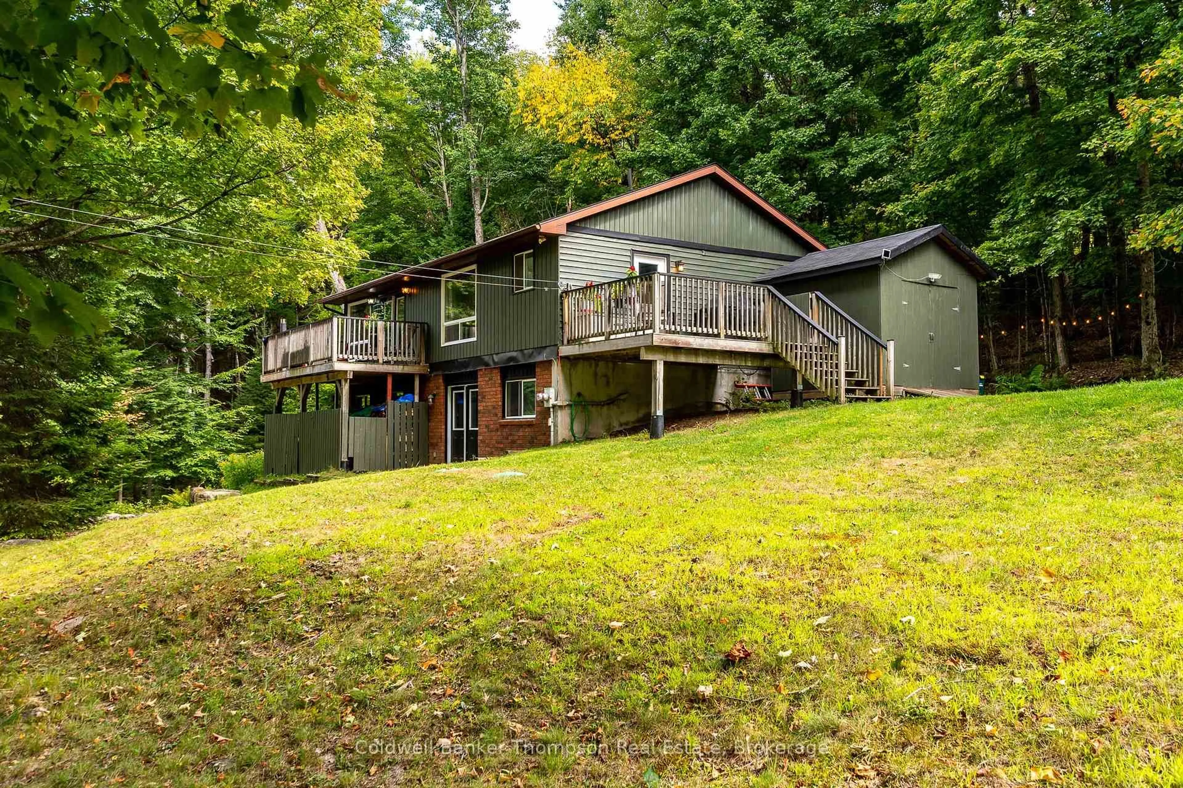 A pic from outside/outdoor area/front of a property/back of a property/a pic from drone, water/lake/river/ocean view for 85 Old Centurion Rd, Huntsville Ontario P1H 2N5