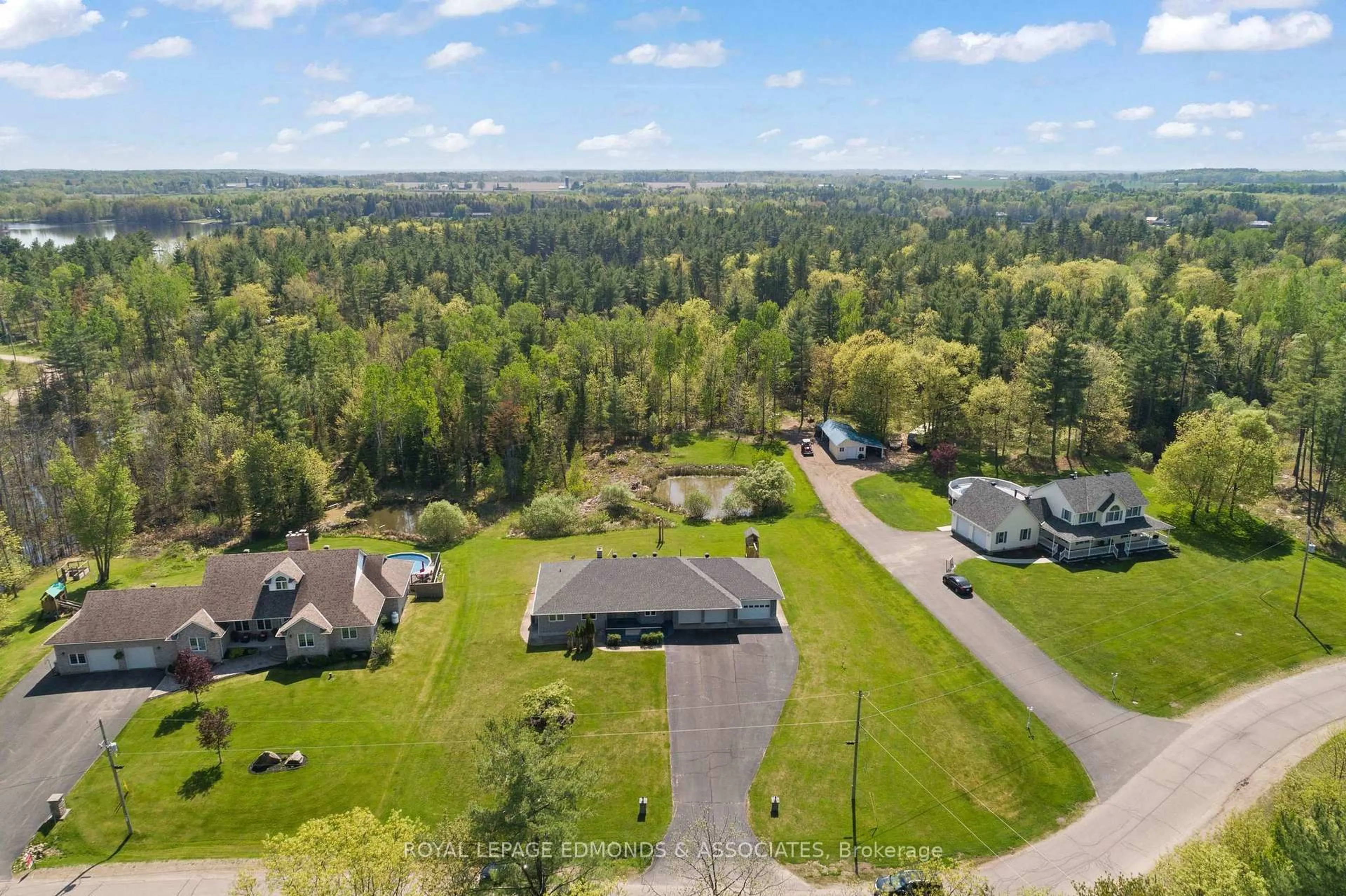 A pic from outside/outdoor area/front of a property/back of a property/a pic from drone, forest/trees view for 40 Blue Danube Way, Pembroke Ontario K8A 6W2