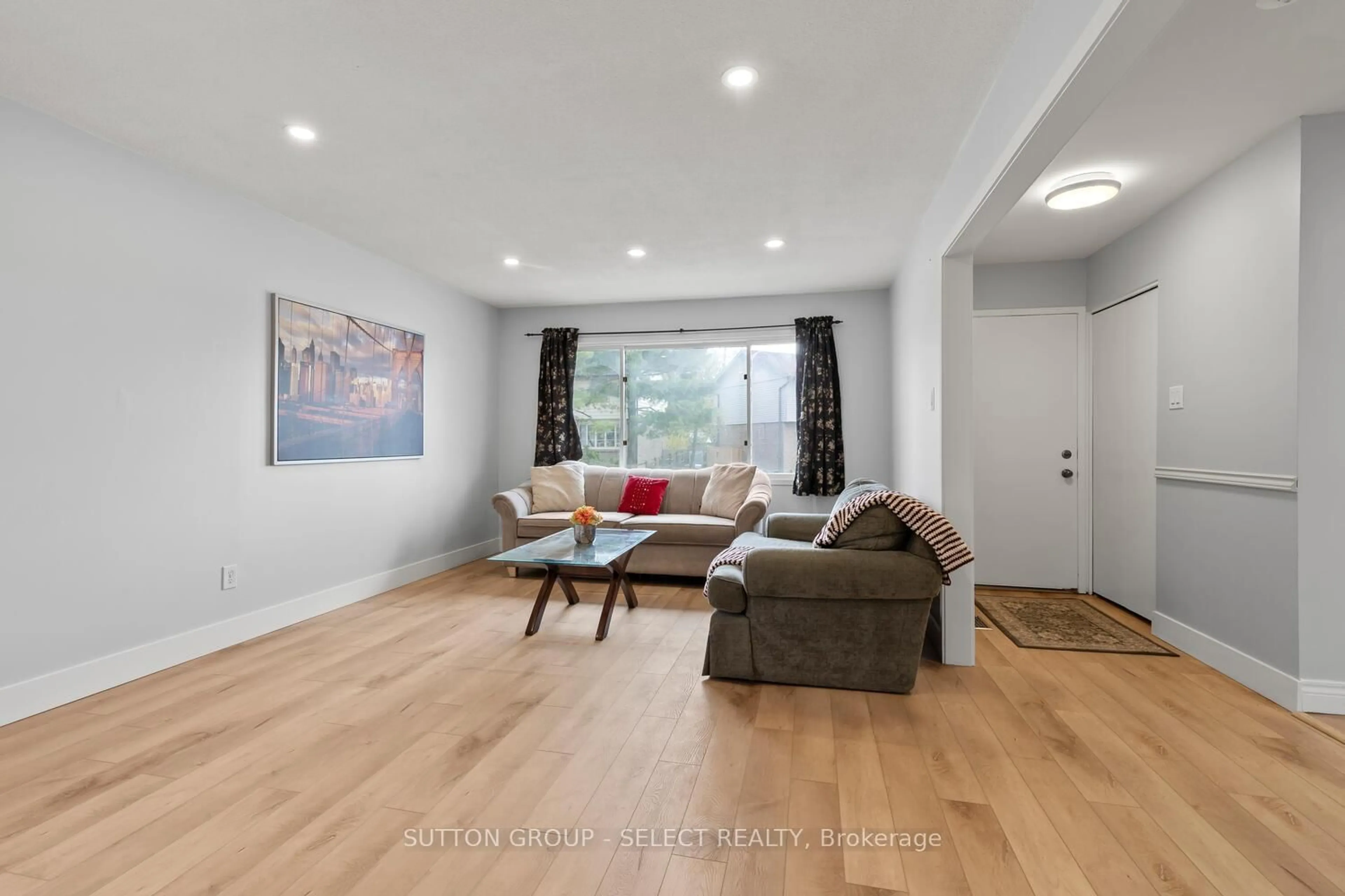 Living room with furniture, wood/laminate floor for 74 Archer Cres, London South Ontario N6E 2A5