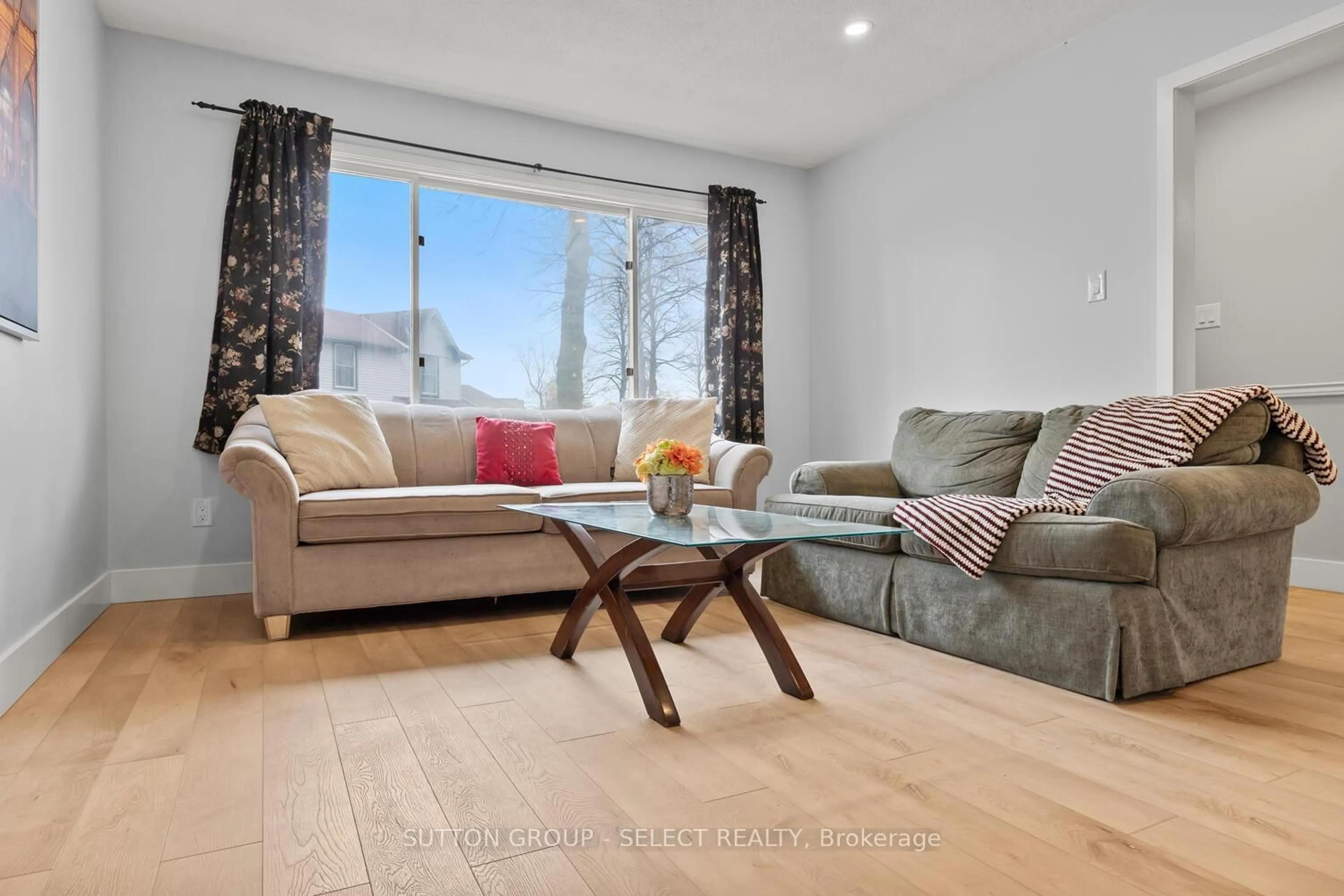 Living room with furniture, wood/laminate floor for 74 Archer Cres, London South Ontario N6E 2A5