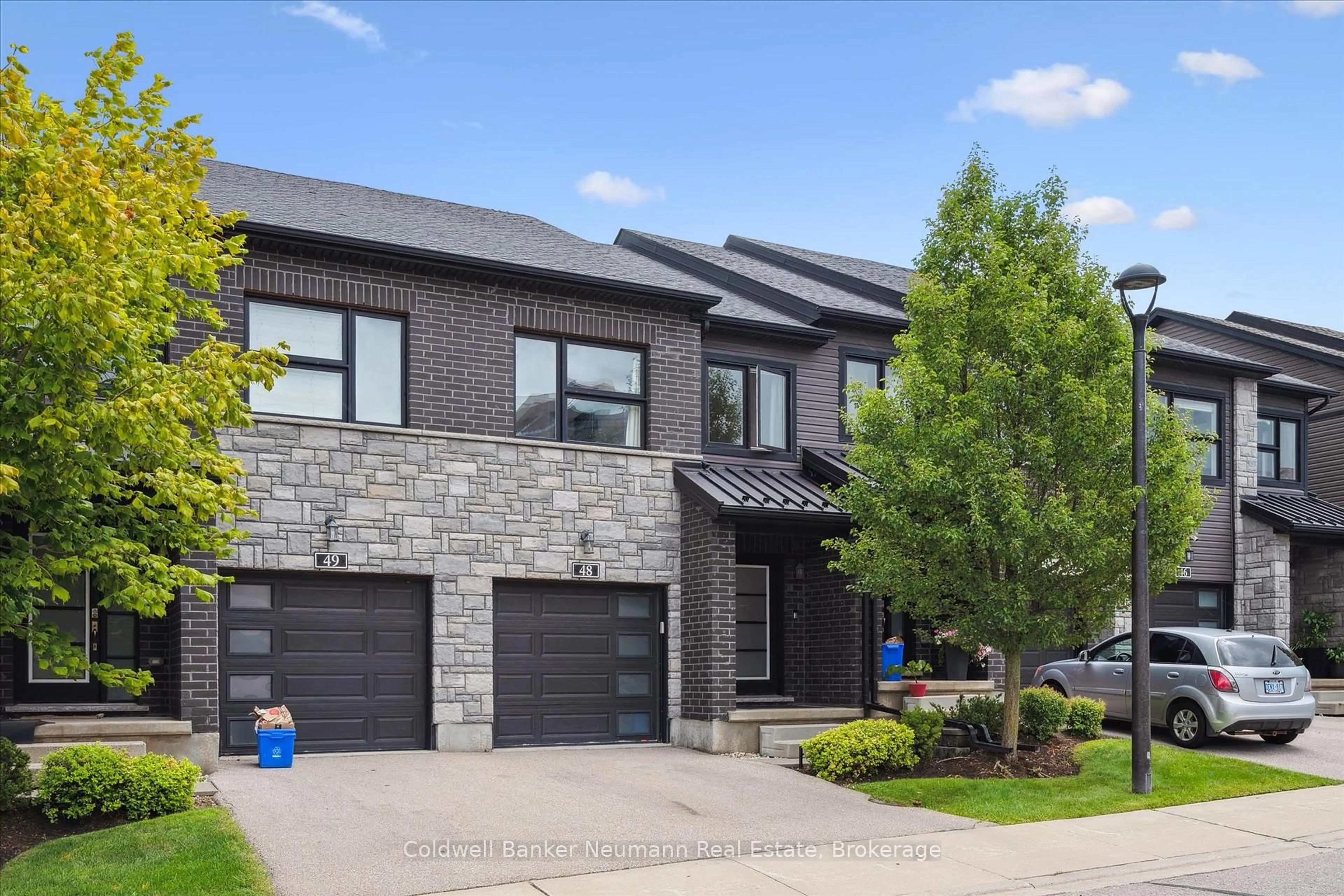 Home with brick exterior material, street for 91 Poppy Dr #48, Guelph Ontario N1L 0M6