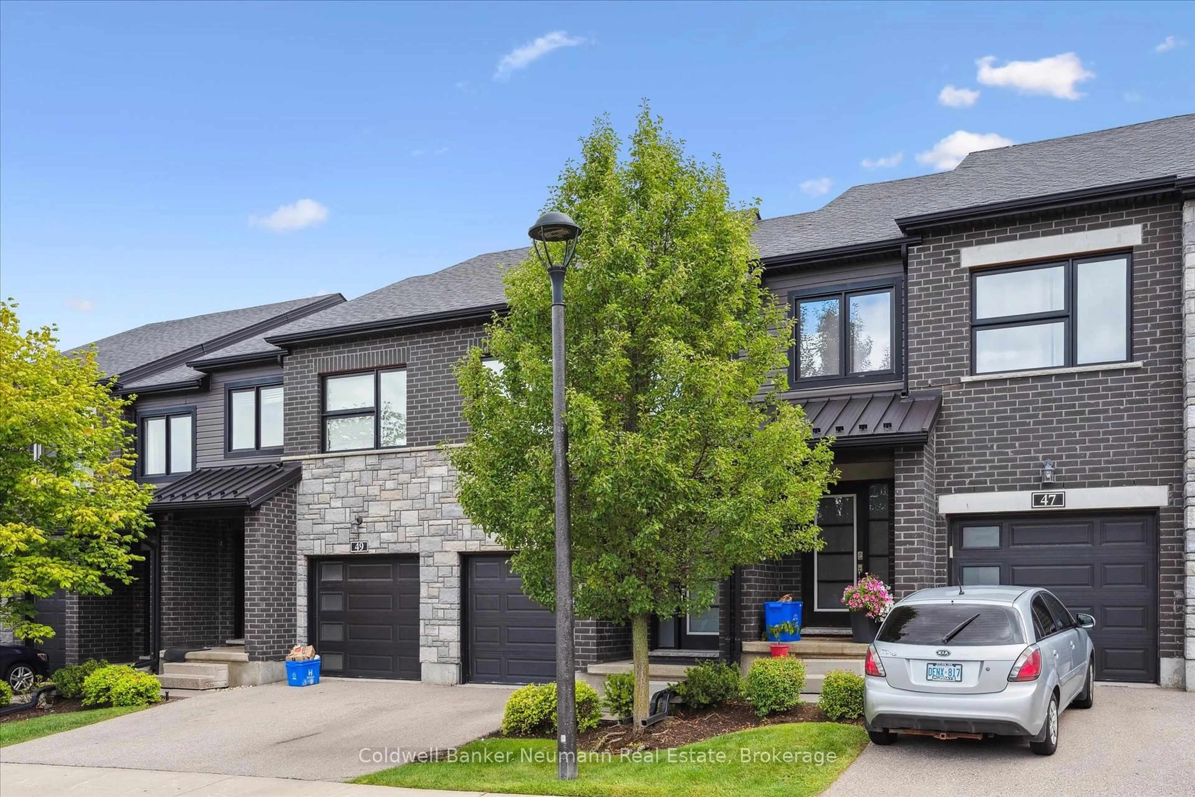Home with brick exterior material, street for 91 Poppy Dr #48, Guelph Ontario N1L 0M6