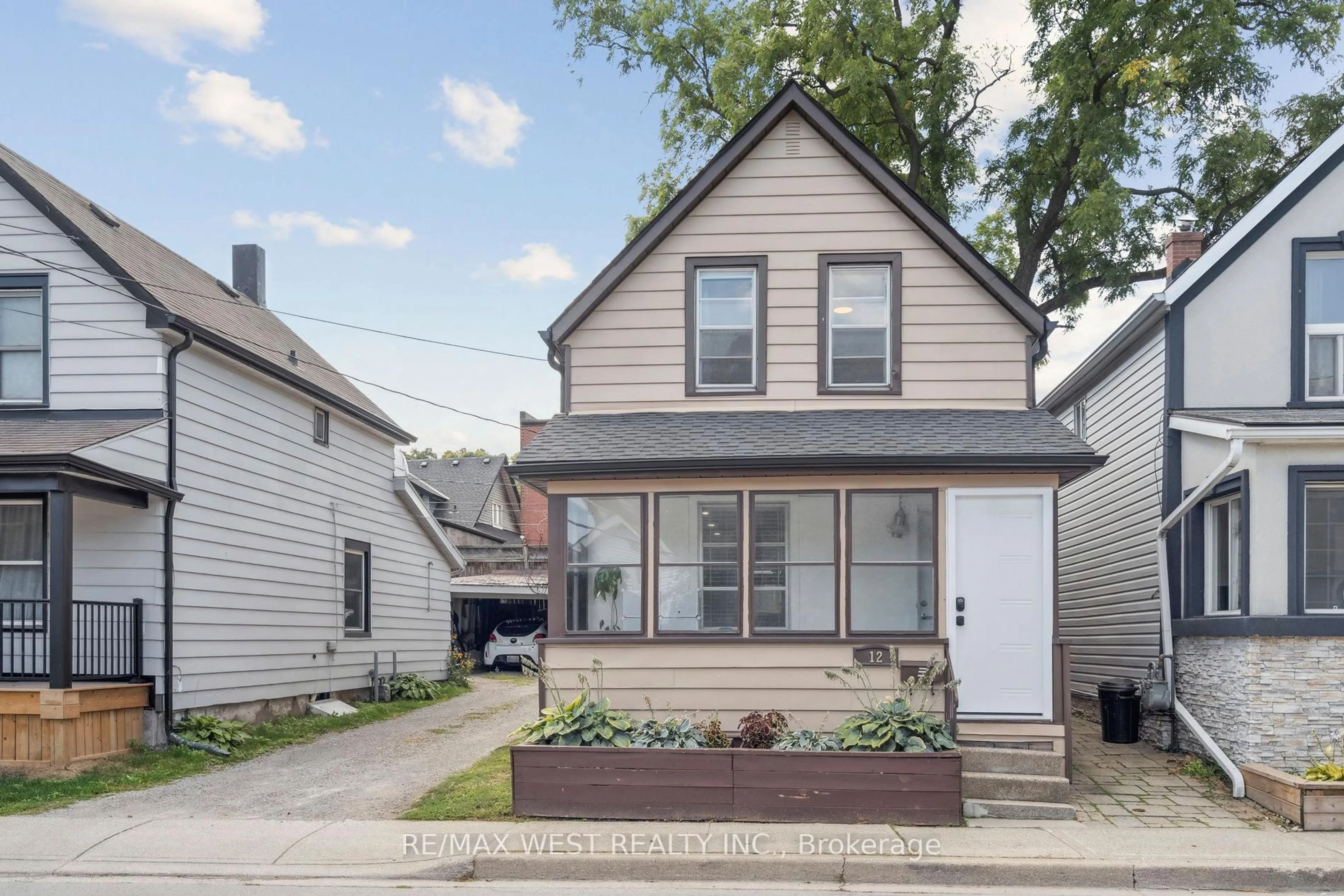 Home with vinyl exterior material, street for 12 Jones St, Hamilton Ontario L8G 3H8